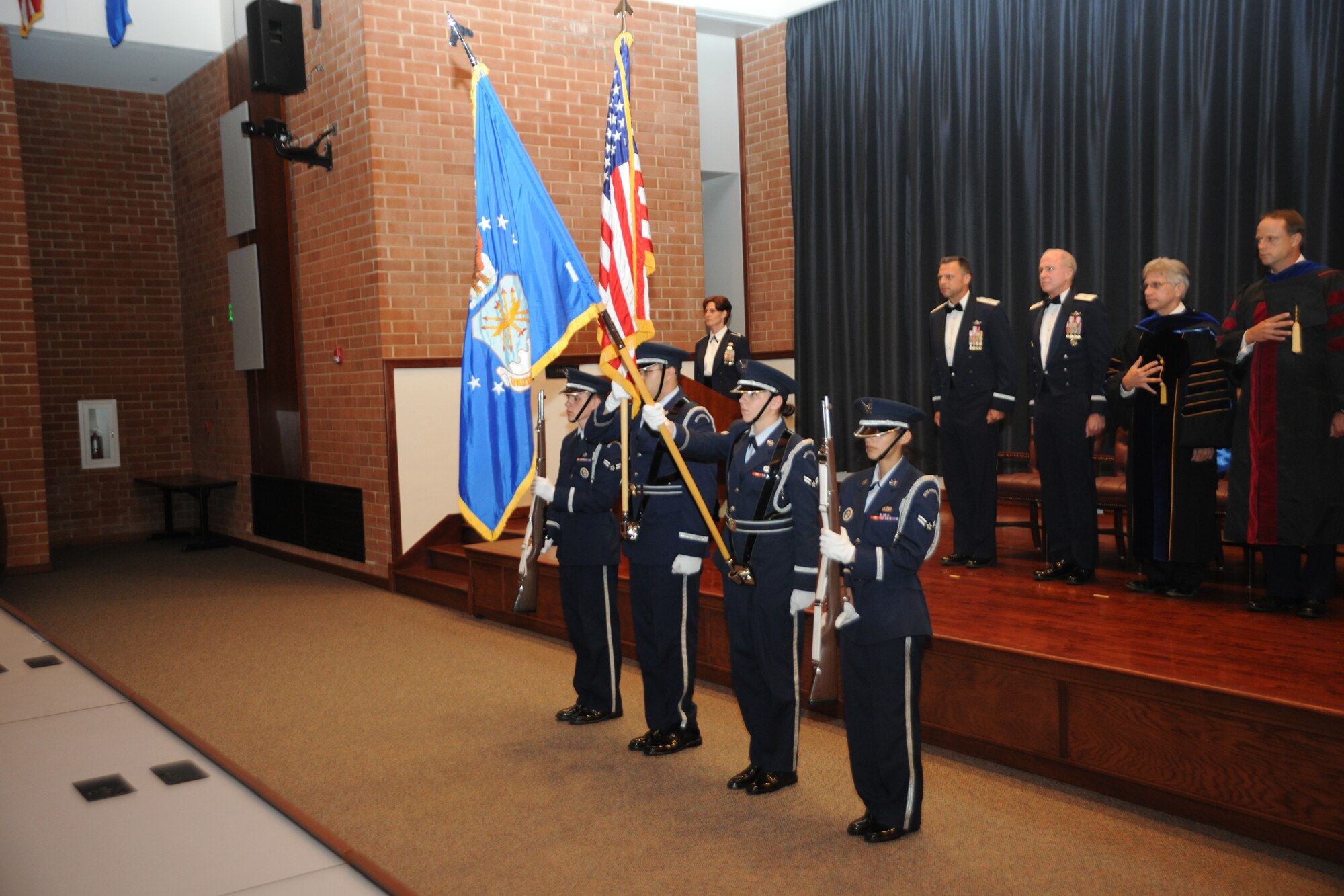 Members of the Joint Base McGuire-Dix-Lakehurst Honor Guard post the colors during the U.S. Air Force Expeditionary Center’s Advanced Study of Air Mobility June 18.  Brig. Gen. Scott Hanson, 321st Expeditionary Wing commander, Brig. Gen. Richard Devereaux, Expeditionary Center commander, and Dr. Paul Wolf, Associate Dean for Academic Affairs for the Air Force Institute of Technology officiated the ceremony and presented master of science degrees to 16 majors for the research in mobility and logistics concepts. (U.S. Air Force photo by Staff Sgt. Zachary Wilson/Released)