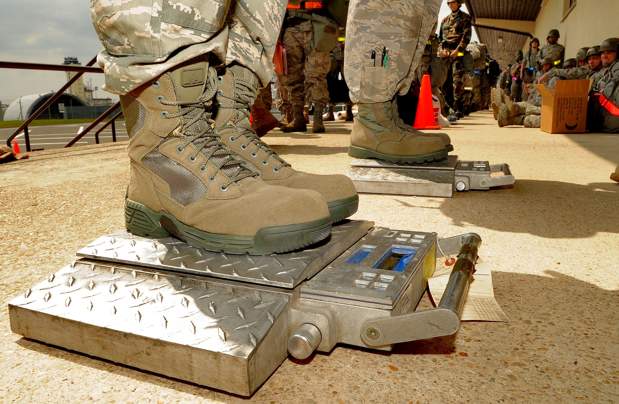 SPANGDAHLEM AIR BASE, Germany – Airmen are weighed for an accountability list given their troup commander that documents all personnel on a simulated aircraft to their tactical area of responsibility before processing through a personnel deployment function during a Phase I Operational Readiness Inspection June 21. The PDF is part of a predeployment checklist Airmen must go through to ensure they have all the proper documentation, medical clearances and requirements to deploy. (U.S. Air Force photo/Airman 1st Class Nick Wilson)