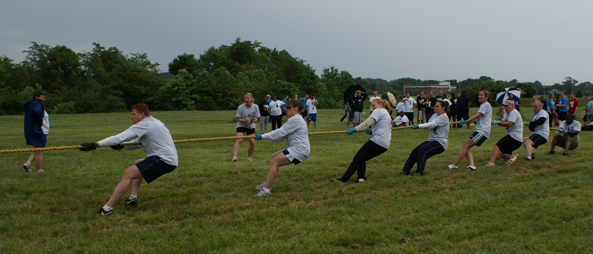 Air Force Office of Special Investigations 10th Field Investigation Squadron team members compete in a recreational Tug-of-War event against Miami Valley businesses during the Battle of the Businesses event held June 5-12.  The event helped raise funds for the Dayton Chapter of Special Olympics. 