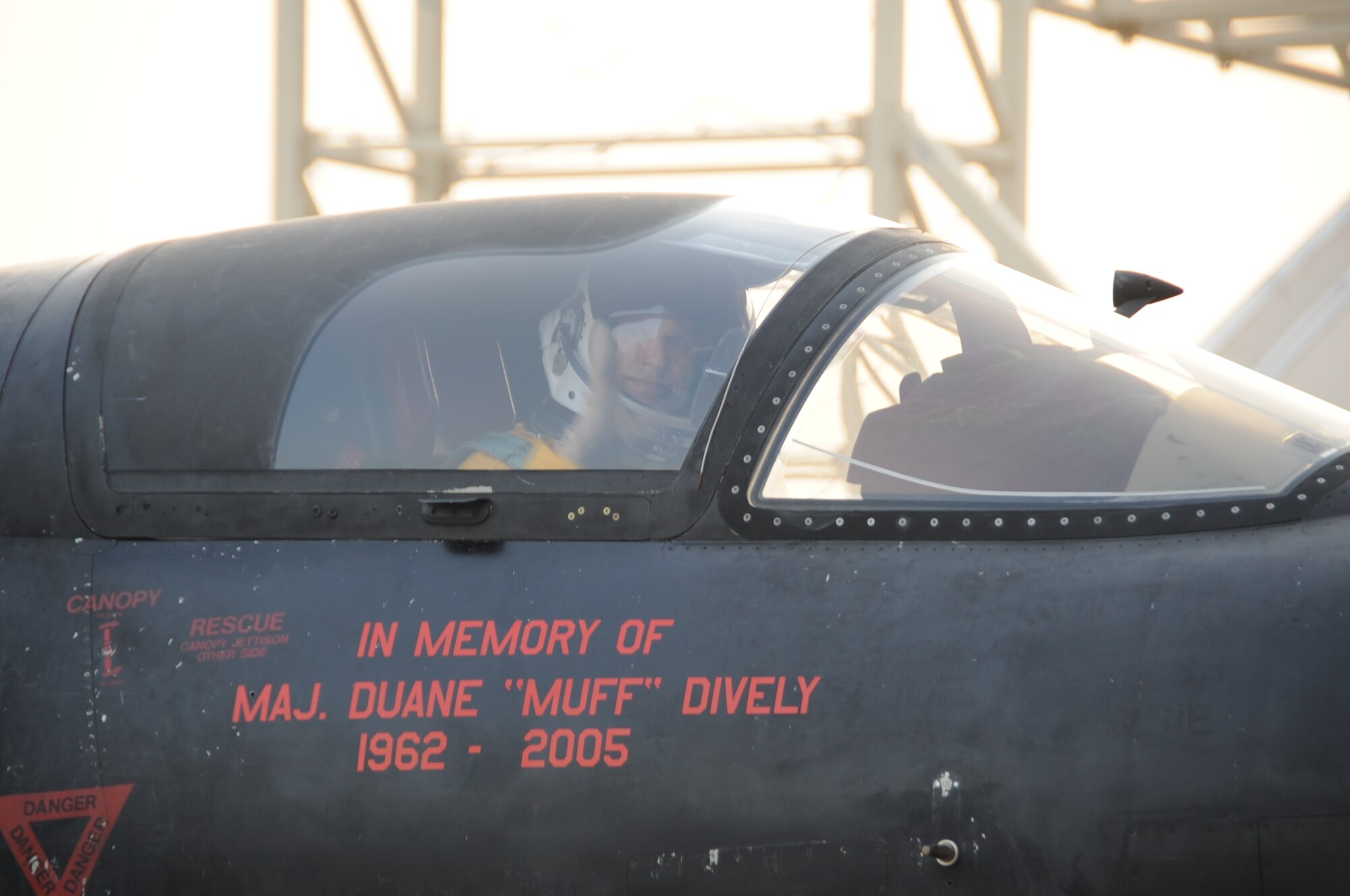 A 380th Air Expeditionary Wing maintainer marshals in a U-2 Dragon Lady after a memorial flight at a non-disclosed base in Southwest Asia June 22. The memorial flight was the fifth held in honor of Maj. Duane Dively, a U-2 pilot that lost his life in a combat mission. (U.S.  Air Force photo/ Tech. Sgt. April Wickes) 