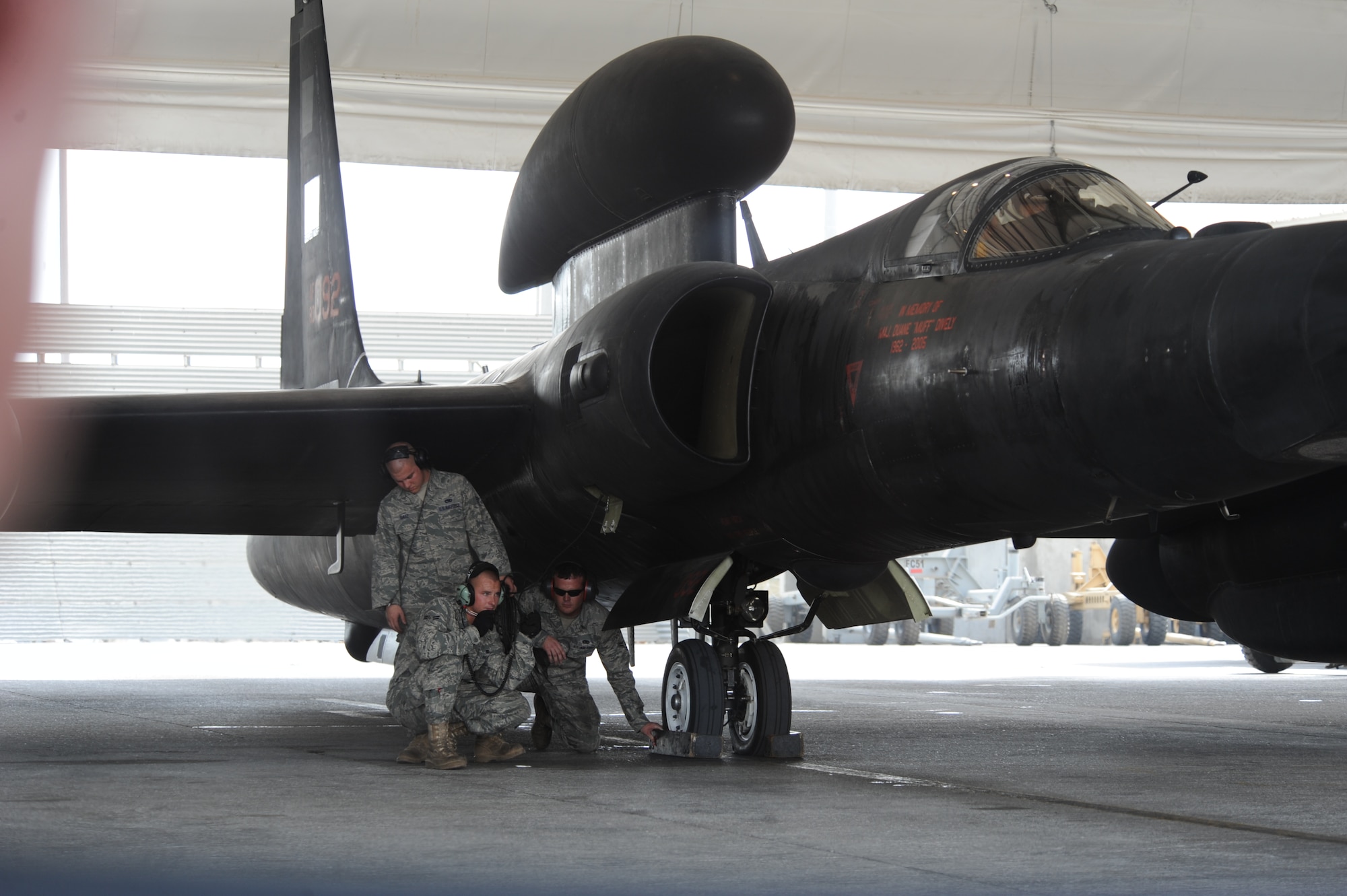 A group of 380th Air Expeditionary Wing maintainers prepare a U-2 Dragon Lady for a memorial flight at a non-disclosed base in Southwest Asia June 22.  The memorial flight was the fifth held in honor of Maj. Duane Dively, a U-2 pilot that lost his life in a combat mission. (U.S.  Air Force photo/ Tech. Sgt. April Wickes) 