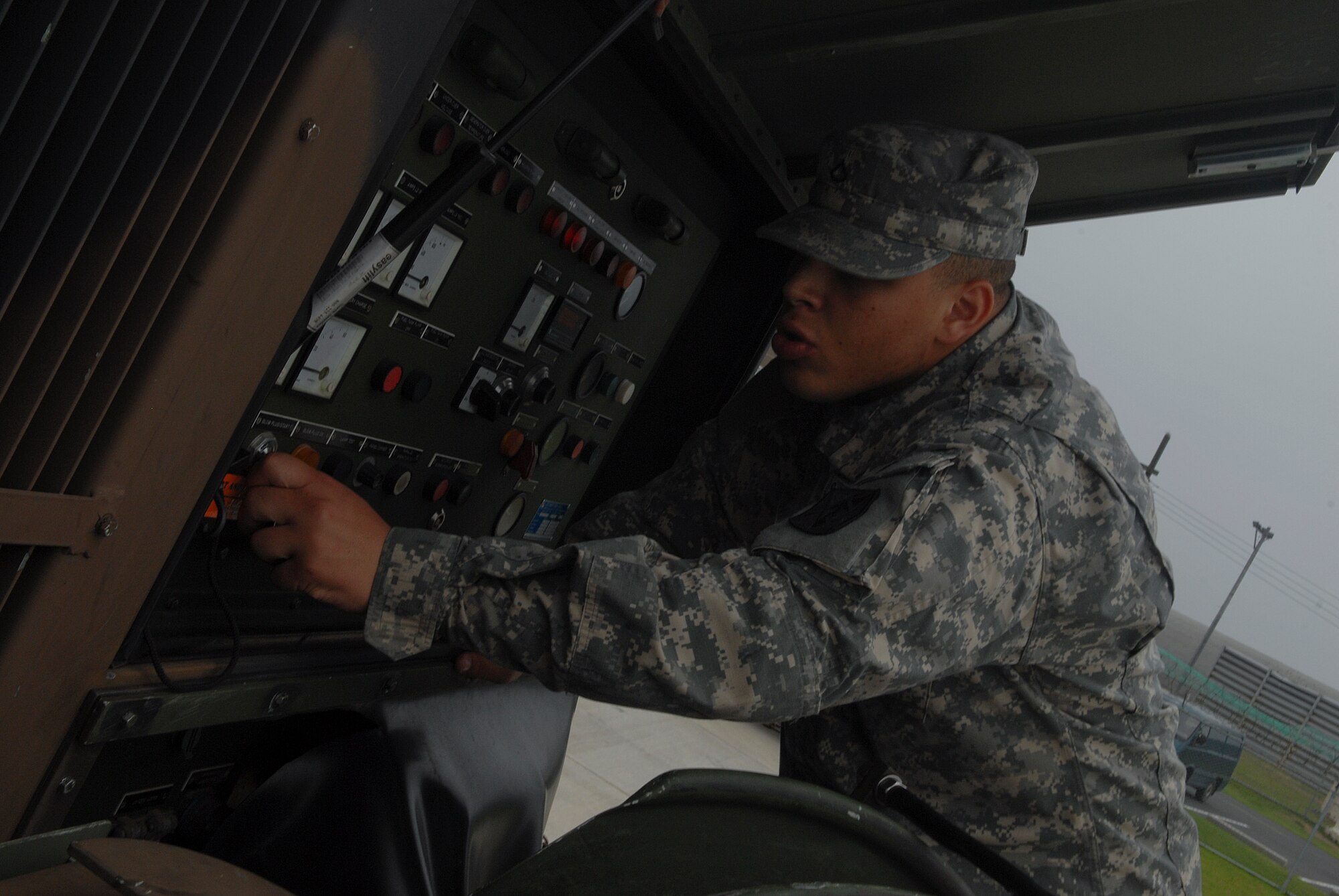 KUNSAN AIR BASE, Republic of Korea -- Private 1st Class Elijah Bible, 2-1 Air Defense Artillery Alpha Battery, turns on an Electric Power Plant Generator. All over Korea, Patriot Advanced Capability Launchers are used in defense of military installations. (U.S. Air Force photo/ Senior Airman Roy Lynch)