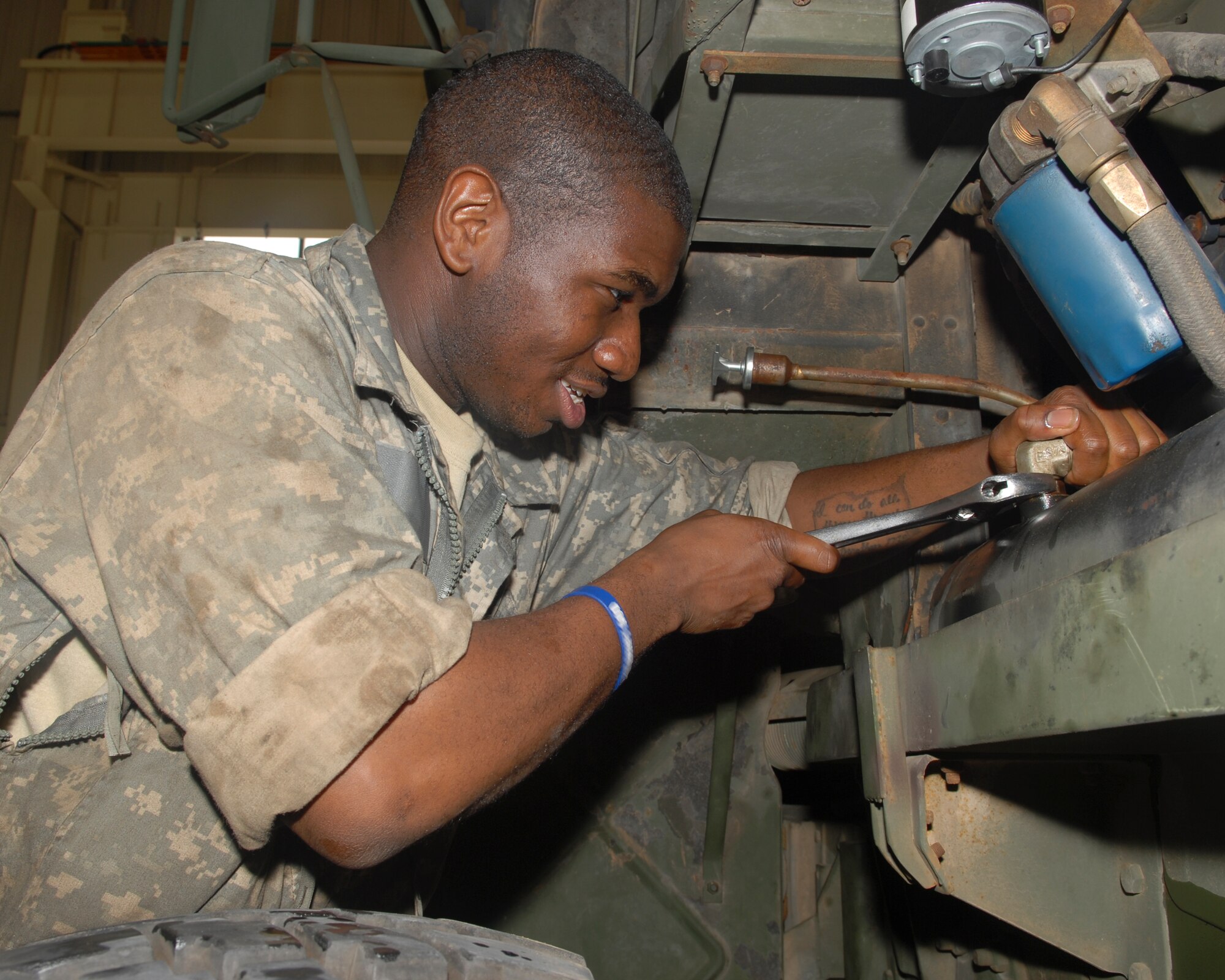 KUNSAN AIR BASE, Republic of Korea -- Specialist Danny McMillon, 2-1 Air Defense Artillery Alpha Battery mechanic, fixes a class 3 leak on an Antenna Mass Group 5-ton truck. All over Korea, Patriot Advanced Capability Launchers are used in defense of military installations. (U.S. Air Force photo/Senior Airman Roy Lynch)