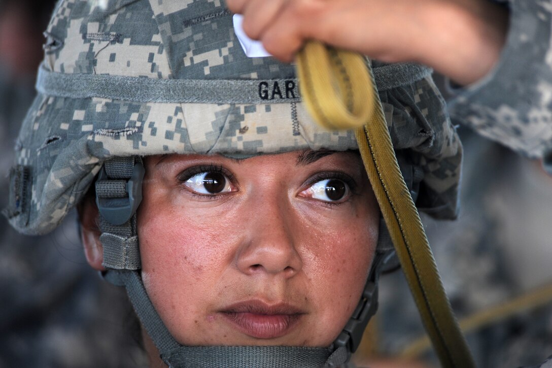 U.S. Army Staff Sgt. Amanda Garcia practices her jumping technique during a joint forcible entry exercise on Pope Air Force Base, N.C. June 21, 2010. Garcia is assigned to the 82nd Airborne Division. The exercise is a primary tool for the 82nd Airborne Division's brigades to train for real-world contingency operations.
