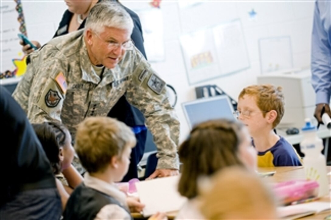 Army Chief of Staff Gen. George W. Casey Jr. speaks with children at the Fort Belvoir Elementary School, Va., on June 22, 2010.  Casey, Secretary of Education Arne Duncan, Jill Biden, wife of Vice President Joe Biden, Deputy Secretary of Defense William J. Lynn III and others visited the school to attend a round table meeting with military members and spouses to discuss the challenges impacting military children and military families.  