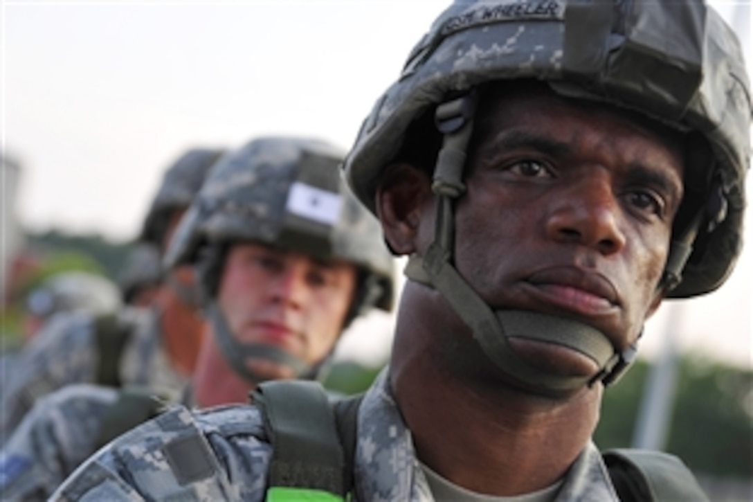 U.S. Army Command Sgt. Maj. Terry Wheeler boards a C-17 Globemaster III cargo aircraft on Pope Air Force Base, N.C., June 22, 2010. Wheeler is assigned to the 82nd Airborne Division's 1st Battalion's 319th Airborne Field Artillery Regiment, and the C-17 crew is stationed out of Charleston Air Force Base, S.C.