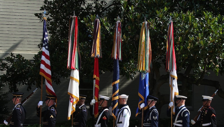 A joint-service color guard stands ready to present the colors during a commemoration ceremony in the Pentagon courtyard June 24, 2010. The event recognized the 60th anniversary of the Korean War and those who fought from Pusan to the Chosin Reservoir.