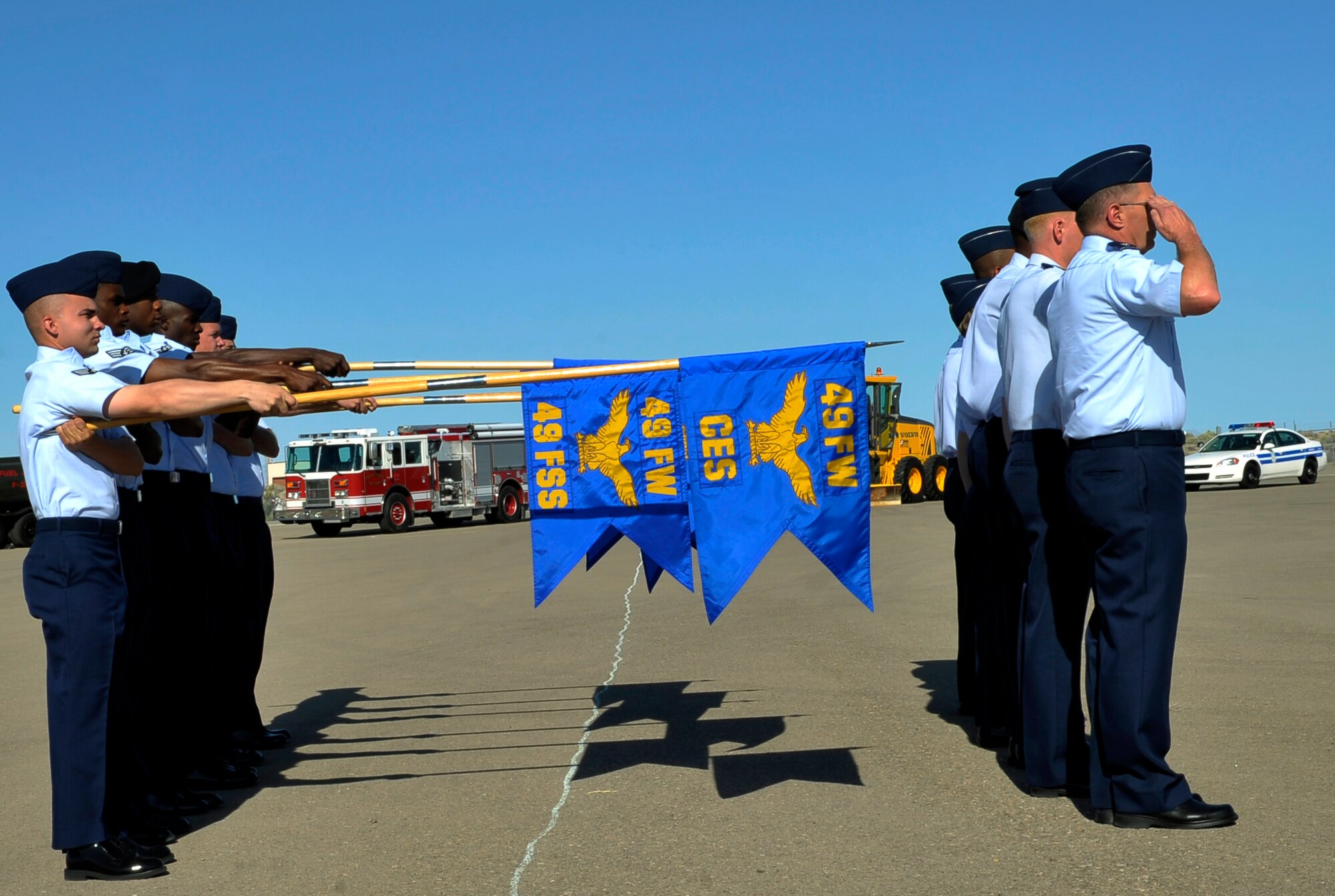 HOLLOMAN AIR FORCE BASE, N.M. -- The 49th Mission Support Group Squadron commanders and guideon bearers present arms during the 49th MSG change of command ceremony June 21, 2010. Col. Stephen DiFonzo relinquished command of the 49th MSG to Col. Robert Cole. Colonel Cole was the director of communications, Air Force Intelligence, surveillance and reconnaissance agency at Lackland AFB, Texas. (U.S. Air Force photo by Airman 1st Class Joshua Turner / Released)