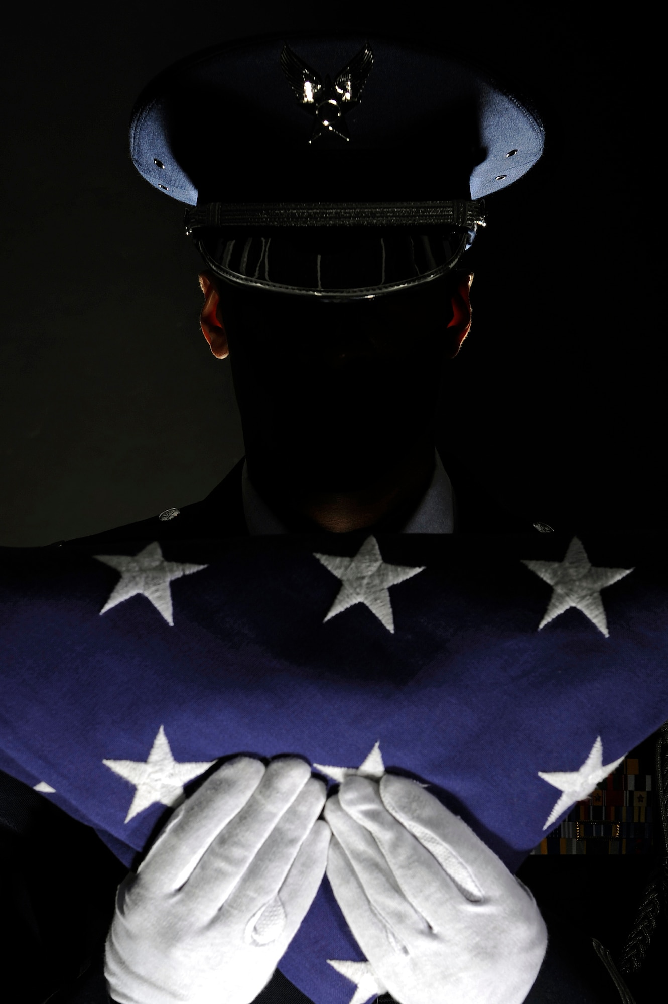 ELLSWORTH AIR FORCE BASE S.D. -- A member of the Ellsworth AFB Honor Guard stands at attention after completing the flag dressing sequence, June 24.  By maintaining our history and exceptionally high standards, Honor Guards will continue to remain an icon of excellence. (U.S. Air Force photo/Staff Sgt. Marc I. Lane)