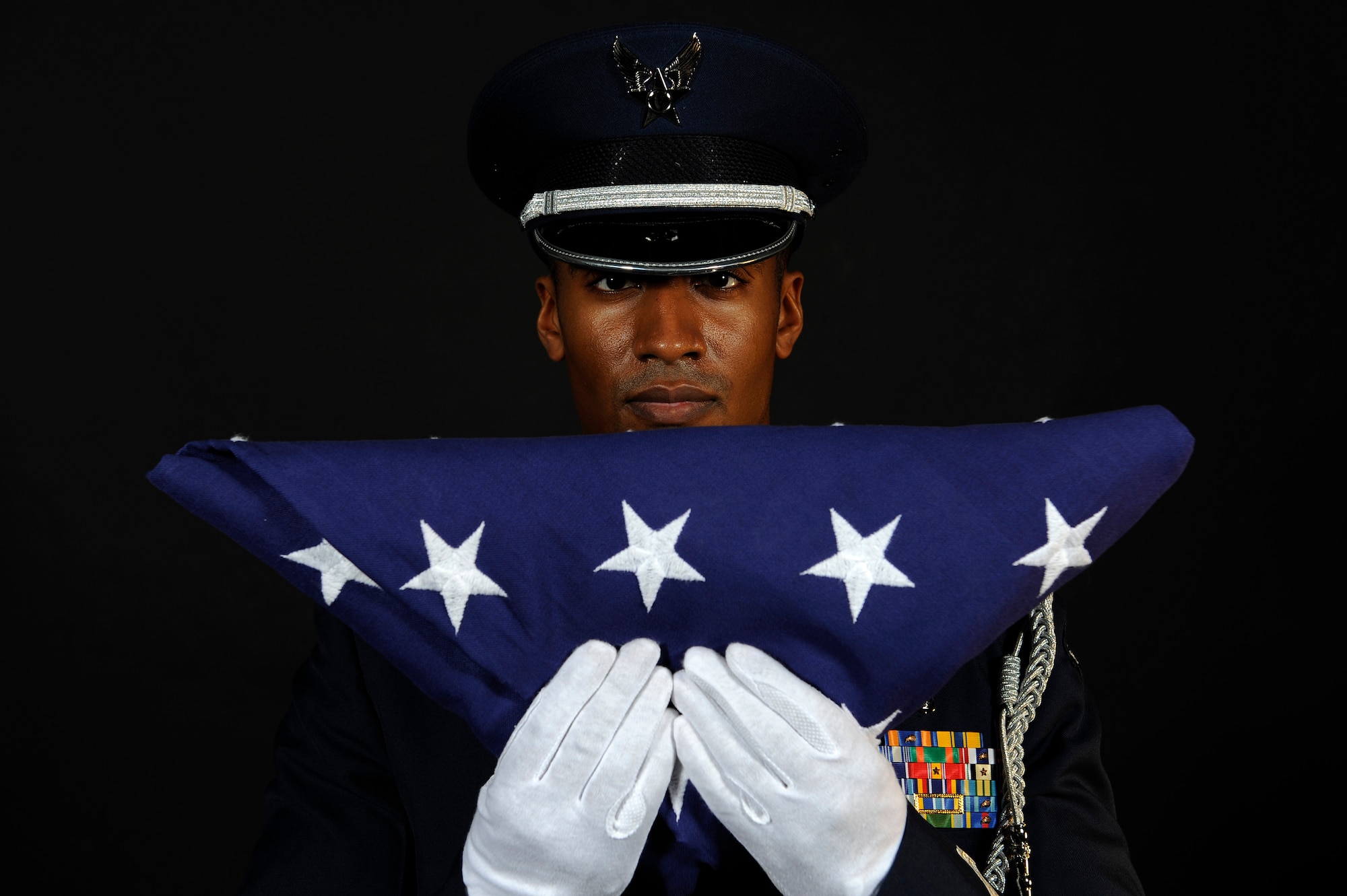 ELLSWORTH AIR FORCE BASE S.D. -- Capt. Bishane Whitmore, Ellsworth AFB Honor Guard officer in charge, stands at attention after completing the flag dressing sequence, June 24.  The Base Honor Guard's primary mission is to represent Ellsworth and the Air Force at public and official ceremonies. (U.S. Air Force photo/Staff Sgt. Marc I. Lane)