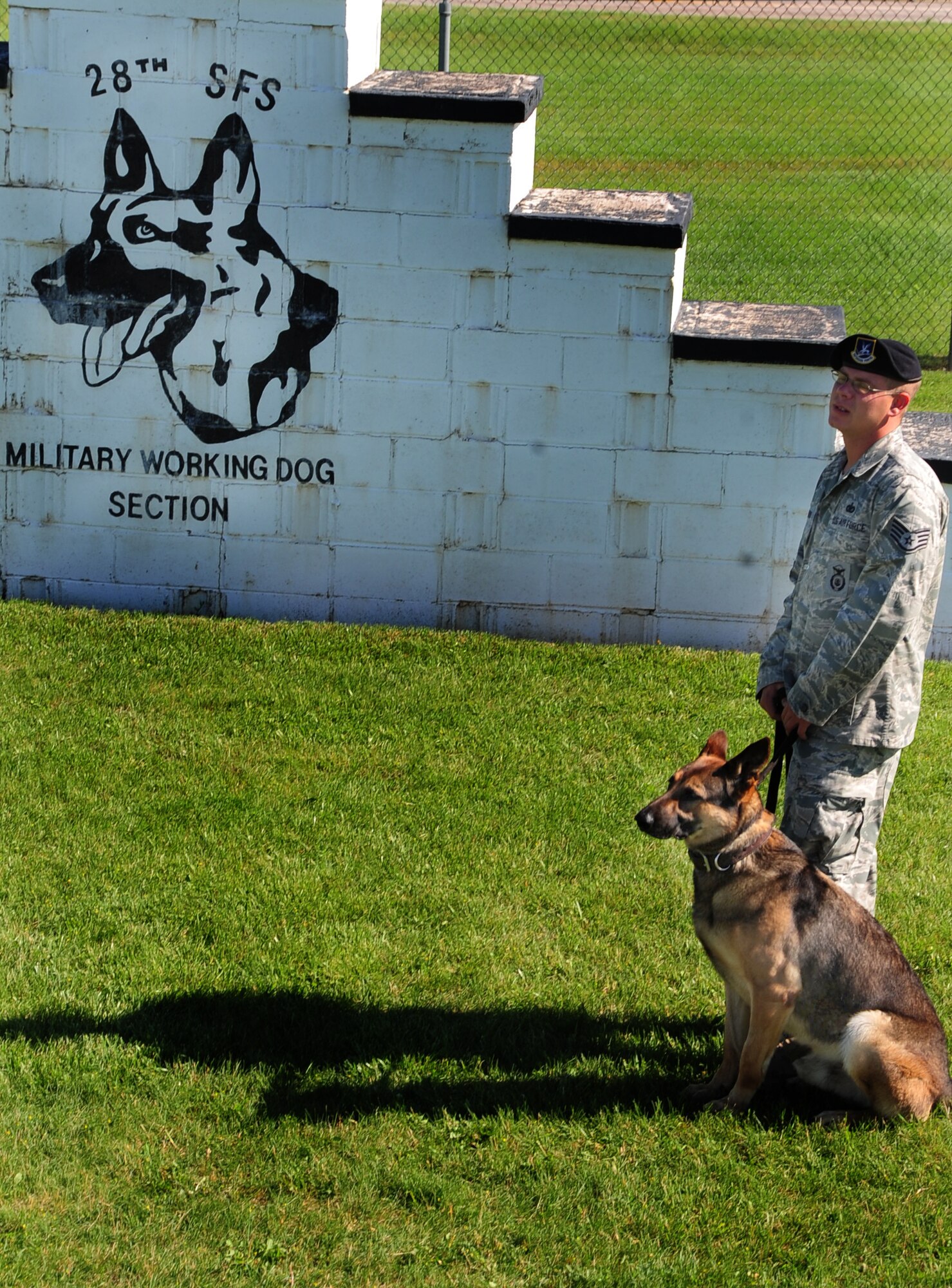 ELLSWORTH AIR FORCE BASE, S.D. -- Staff Sgt. Christopher Darrow, 28th Security Forces Squadron dog handler, stands ready to conduct training with his military working dog, Bak, June 24.  Sergeant Darrow has been a dog handler slightly more than four months, with Bak as his first MWD. (U.S. Air Force photo/Airman 1st Class Anthony Sanchelli)