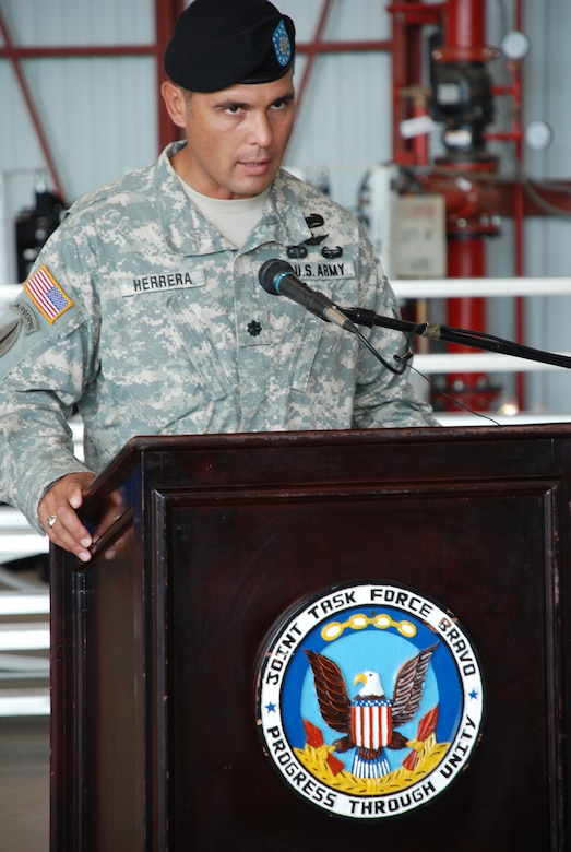 SOTO CANO AIR BASE, Republic of Honduras --  Lt. Col. Salome Herrera Jr. says farewell to his "familia" during the 1st Battalion, 228th Aviation Regiment change of command ceremony here June 24. Colonel Herrera handed over command of the unit to Lt. Col. James Kanicki before heading to his next assignment at Fort Campbell, Ky. (U.S. Air Force photo/Tech. Sgt. Benjamin Rojek)