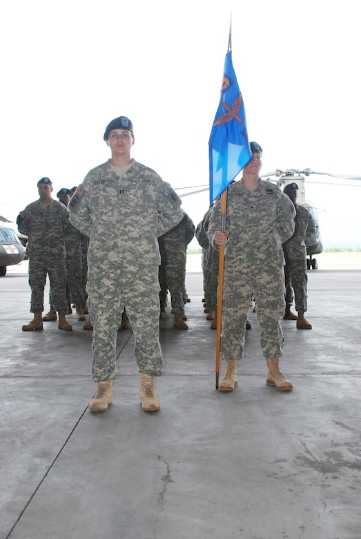 SOTO CANO AIR BASE, Republic of Honduras --  Capt. Elizabeth Eaton-Ferenzi, commander of A Company of the 1st Battalion, 228th Aviation Regiment, and Spc. Jennifer Federman, an A Company crew chief, stand at parade rest during a change of command ceremony here June 24. Lt. Col. James Kanicki took command of the 1st Battalion, 228th Aviation regiment from Lt. Col. Salome Herrera Jr. (U.S. Air Force photo/Tech. Sgt. Benjamin Rojek)
