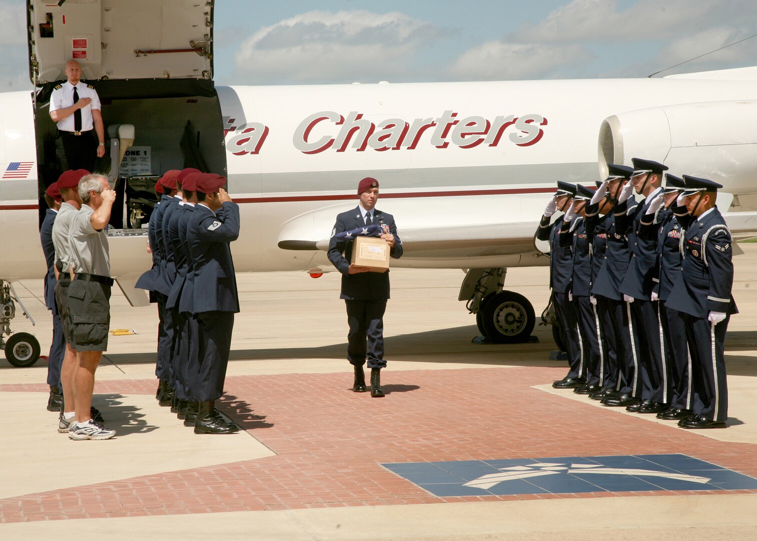 The urn carrying the remains of Staff Sgt. Michael P. Flores arrives at Lackland June 18. Tech. Sgt. Michael P. Flores, an Airman from San Antonio, was killed while supporting Operation Enduring Freedom. Sergeant Flores was assigned to the 48th Rescue Squadron, Davis-Monthan Air Force Base, Ariz. (U.S. Air Force photo/Robbin Cresswell) 