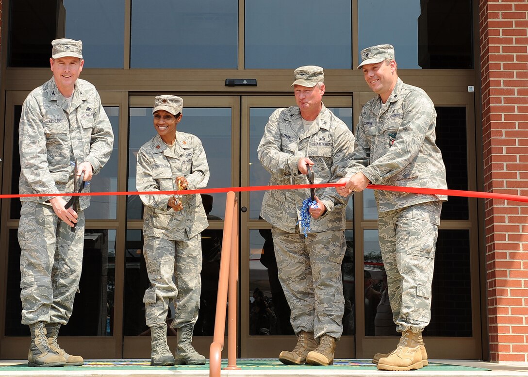 LANGLEY AIR FORCE BASE, Va. -- Col. Donald Kirkland, 633d Air Base Wing commander, Maj. Jenise Carroll, 633d Force Support Squadron commander, Col. Kevin Altman, 633d Mission Support Group commander, and Lt. Col. Jeffrey Ullmann, 633d Civil Engineer Squadron commander, cut the ribbon in front of the new Langley Lanes bowling center June 22.   The renovations include an arcade, new bowling equipment and upgraded customer facilities. (U.S. Air Force photo/Senior Airman Gul Crockett)

