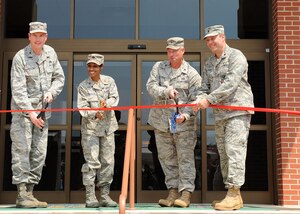 LANGLEY AIR FORCE BASE, Va. -- Col. Donald Kirkland, 633d Air Base Wing commander, Maj. Jenise Carroll, 633d Force Support Squadron commander, Col. Kevin Altman, 633d Mission Support Group commander, and Lt. Col. Jeffrey Ullmann, 633d Civil Engineer Squadron commander, cut the ribbon in front of the new Langley Lanes bowling center June 22.   The renovations include an arcade, new bowling equipment and upgraded customer facilities. (U.S. Air Force photo/Senior Airman Gul Crockett)

