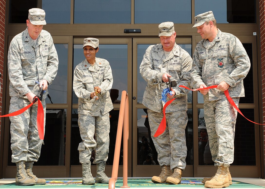 LANGLEY AIR FORCE BASE, Va. -- Col. Donald Kirkland, 633d Air Base Wing commander, Maj. Jenise Carroll, 633d Force Support Squadron commander, Col. Kevin Altman, 633d Mission Support Group commander, and Lt. Col. Jeffrey Ullmann, 633d Civil Engineer Squadron commander, cut the ribbon in front of the new Langley Lanes bowling center June 22.   The renovations include an arcade, new bowling equipment and upgraded customer facilities. (U.S. Air Force photo/Senior Airman Gul Crockett)

