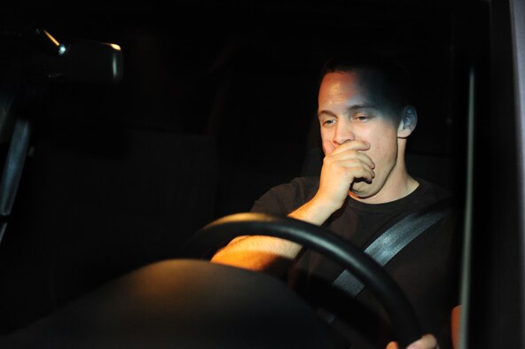 ELLSWORTH AIR FORCE BASE, S.D. -- Senior Airman David Carter, 28th Maintenance Squadron aerospace ground equipment journeyman, yawns while driving at night, which shows fatigued driving symptoms, June 23.  Driving while fatigued is as dangerous as driving while intoxicated because both severely slow reaction time. (U.S Air Force photo/Airman 1st Class Anthony Sanchelli)