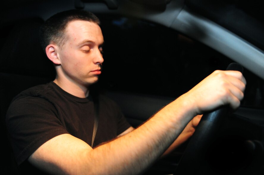 ELLSWORTH AIR FORCE BASE, S.D. -- Senior Airman David Carter, 28th Maintenance Squadron aerospace ground equipment journeyman, slowly blinks his eyes, showing fatigued driving symptoms, June 23.  Driving while fatigued has the same risks as driving while intoxicated. (U.S Air Force photo/Airman 1st Class Anthony Sanchelli)