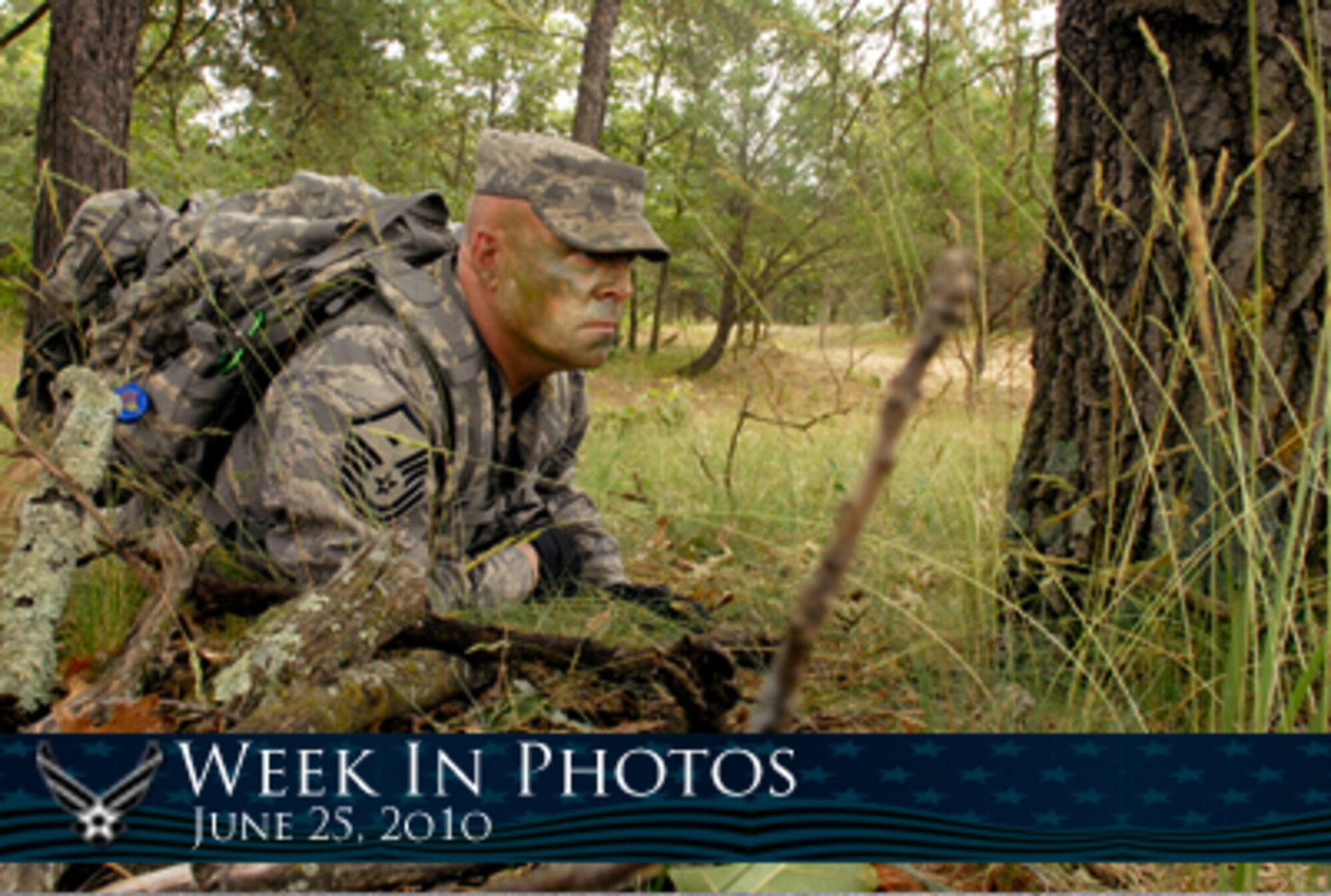 Air Force Week in Photos for June 25, 2010, highlights photos from around the Air Force. In this photo by Tech. Sgt. Ashley Bell,  Master Sgt. Kent Falstad takes part in a land navigation exercise June 13, 2010, at Volk Field Combat Readiness Training Center in Wisconsin. (U.S. Air Force photo illustration/Corey Parrish)
