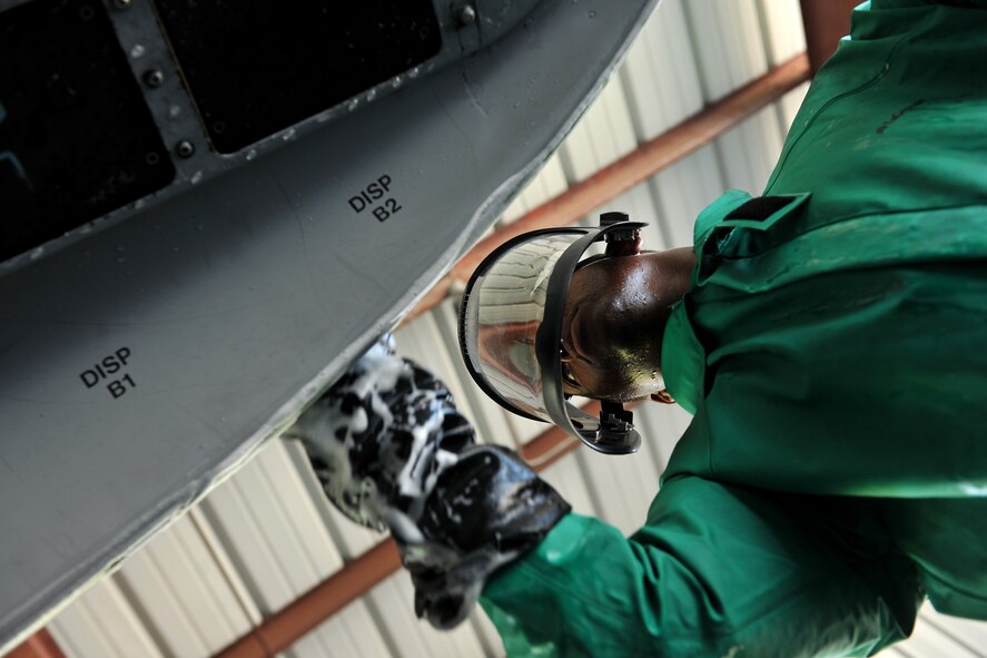 MOODY AIR FORCE BASE, Ga. -- Senior Airman Eldrin Davidson, 23rd Aircraft Maintenance Squadron crew chief, cleans the outside wing of an A-10C Thunderbolt II here June 16. It usually takes up to four Airmen to clean the entire aircraft. (U.S. Air Force photo by Airman 1st Class Joshua Green/RELEASED)