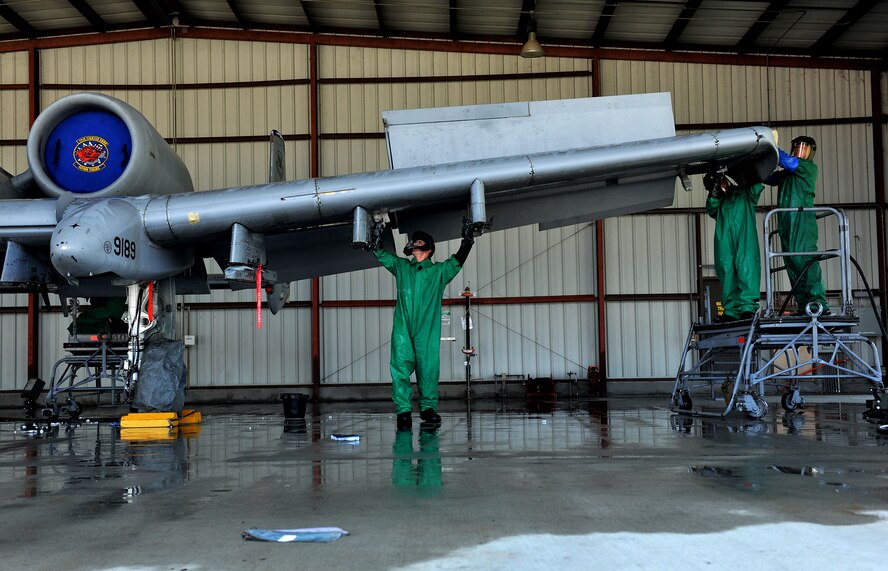 MOODY AIR FORCE BASE, Ga. -- Airmen from the 23rd Aircraft Maintenance Squadron, clean the wing of an A-10C Thunderbolt II here June 16. The wash, which is required every 180 days, takes approximately two to four hours depending on the weather conditions. (U.S. Air Force photo by Airman 1st Class Joshua Green/RELEASED)