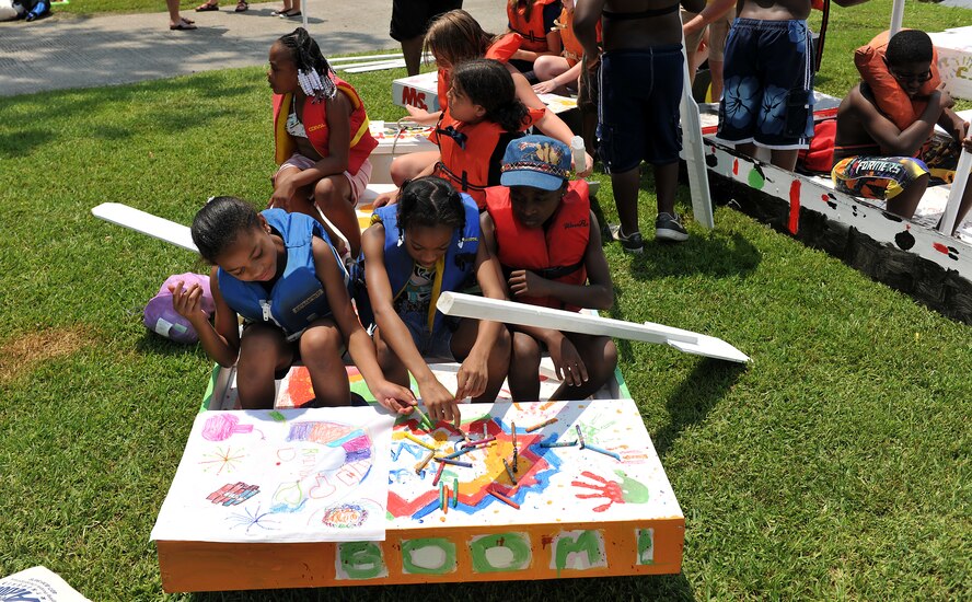 MOODY AIR FORCE BASE, Ga. -- Youth make flags for their sailboats during the Youth Center Launching event at Grassy Pond in Valdosta, Ga., June 18. They built, painted, made flags and named their sailboats, which took approximately a week to complete. (U.S. Air Force photo by Airman 1st Class Joshua Green/RELEASED)