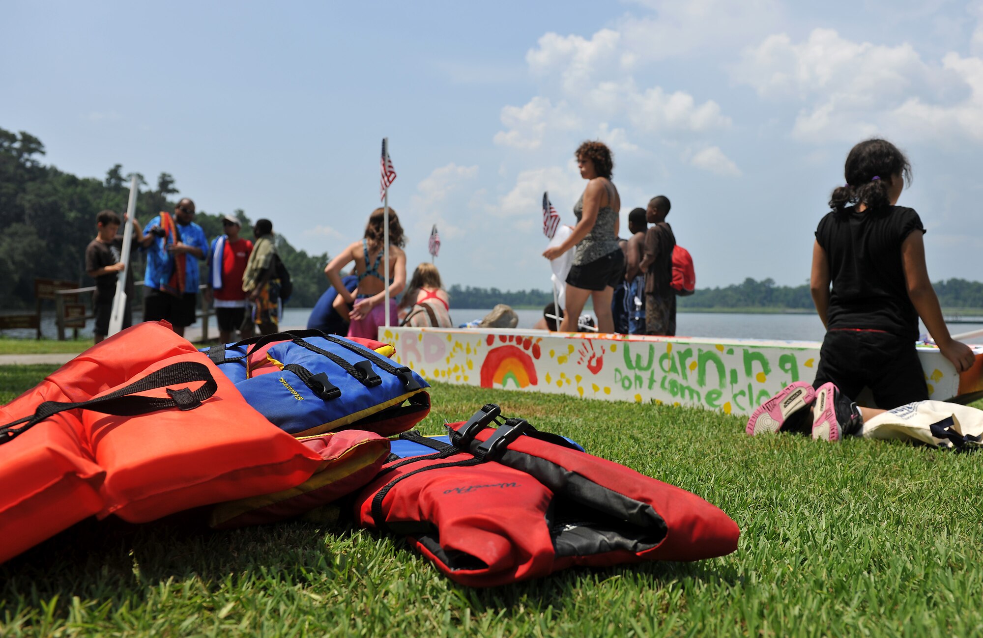 MOODY AIR FORCE BASE, Ga. -- A stack of life vests lay in a pile ready for use during the Youth Center Boat Launching event at Grassy Pond in Valdosta, Ga., June 18. The event was held to test sailboats built by the youth at the Youth Center. (U.S. Air Force photo by Airman 1st Class Joshua Green/RELEASED)