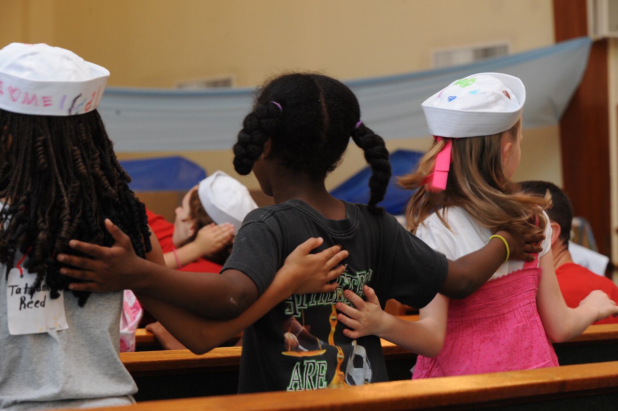 Team McConnell children sing together at Vacation Bible School June 18, 2010, McConnell Air Force Base, Kan.  The children learned how to apply the Bible to their lives and develop personal relationships during the week long VBS.  VBS had an ice cream social for VBS volunteers, VBS children and their families on Friday to celebrate.  VBS children also were invited to attend 11 a.m. Sunday worship at the base chapel to showcase the songs they learned for praise and worship. (U.S. Air Force photo/Tech. Sgt. Chyrece 