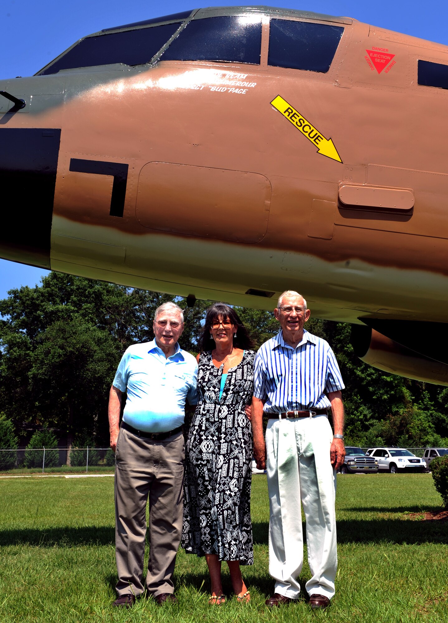 100618-F-4406D-009 SHAW AIR FORCE BASE, S.C.--  Lt. Col. (Ret.) Clyde Ream, Victoria Sands who was representing her father Lt. Col. (Ret.) Joe Summerour and Senior Master Sgt. (Ret.) Bud Page, pose for a picture in front of the RB-66C static airplane here, June 18, 2010. Friends and family came together to honor the three servicemembers, who recently has their names put on the static display. (U.S. Air Force photo/ Airman 1st Class Tabatha L. Duarte)