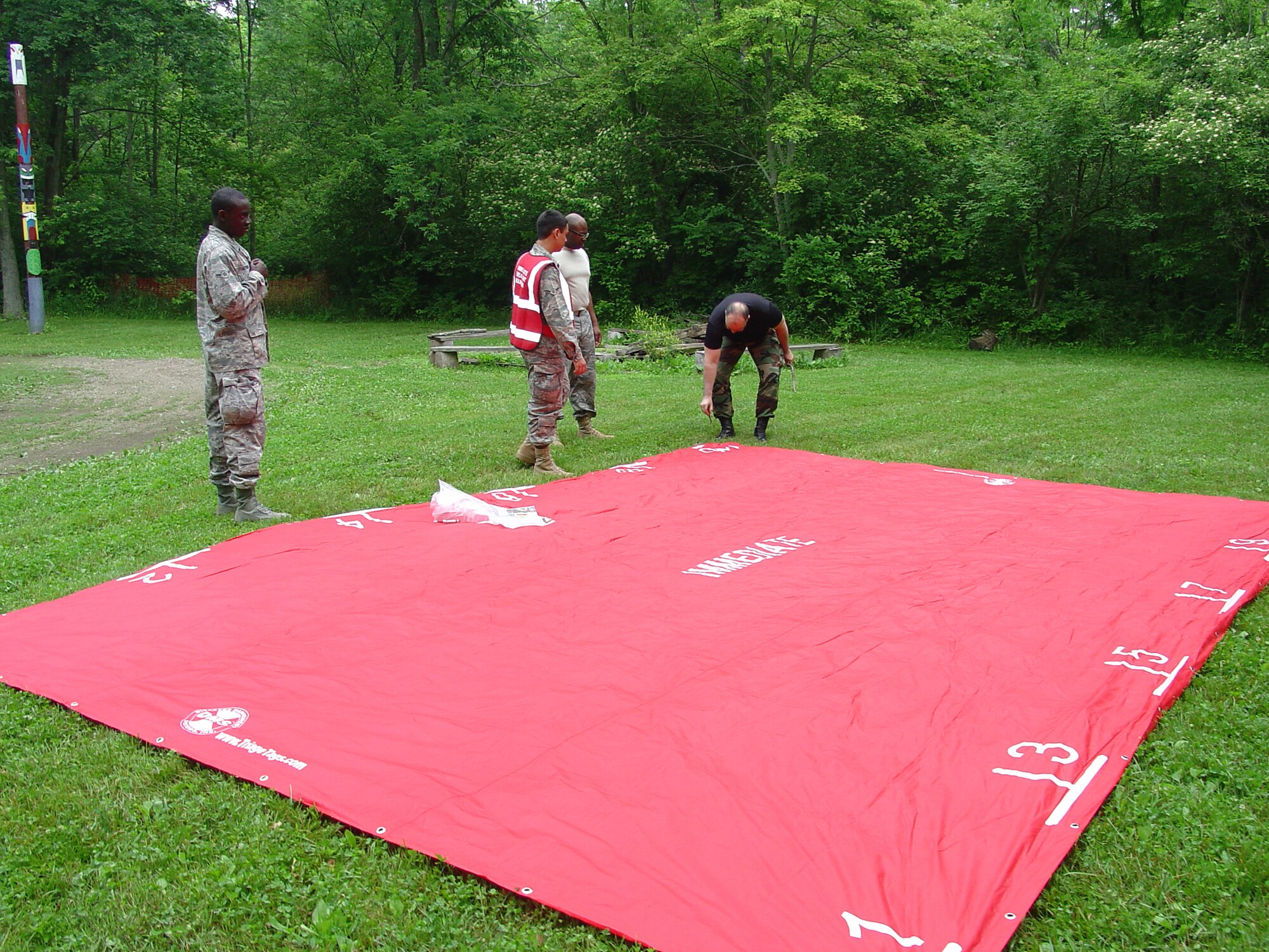 WRIGHT-PATTERSON AIR FORCE BASE, Ohio – Reservists from the 445th Aeromedical Staging Squadron set up triage zones during a field training exercise held at Camp Birch in Yellow Springs, Ohio, June 5.  The field training exercise gave the reservists a chance to work as a group to polish their skills they would use in deployed locations. (U.S. Air Force photo/Maj. Mary Reed)