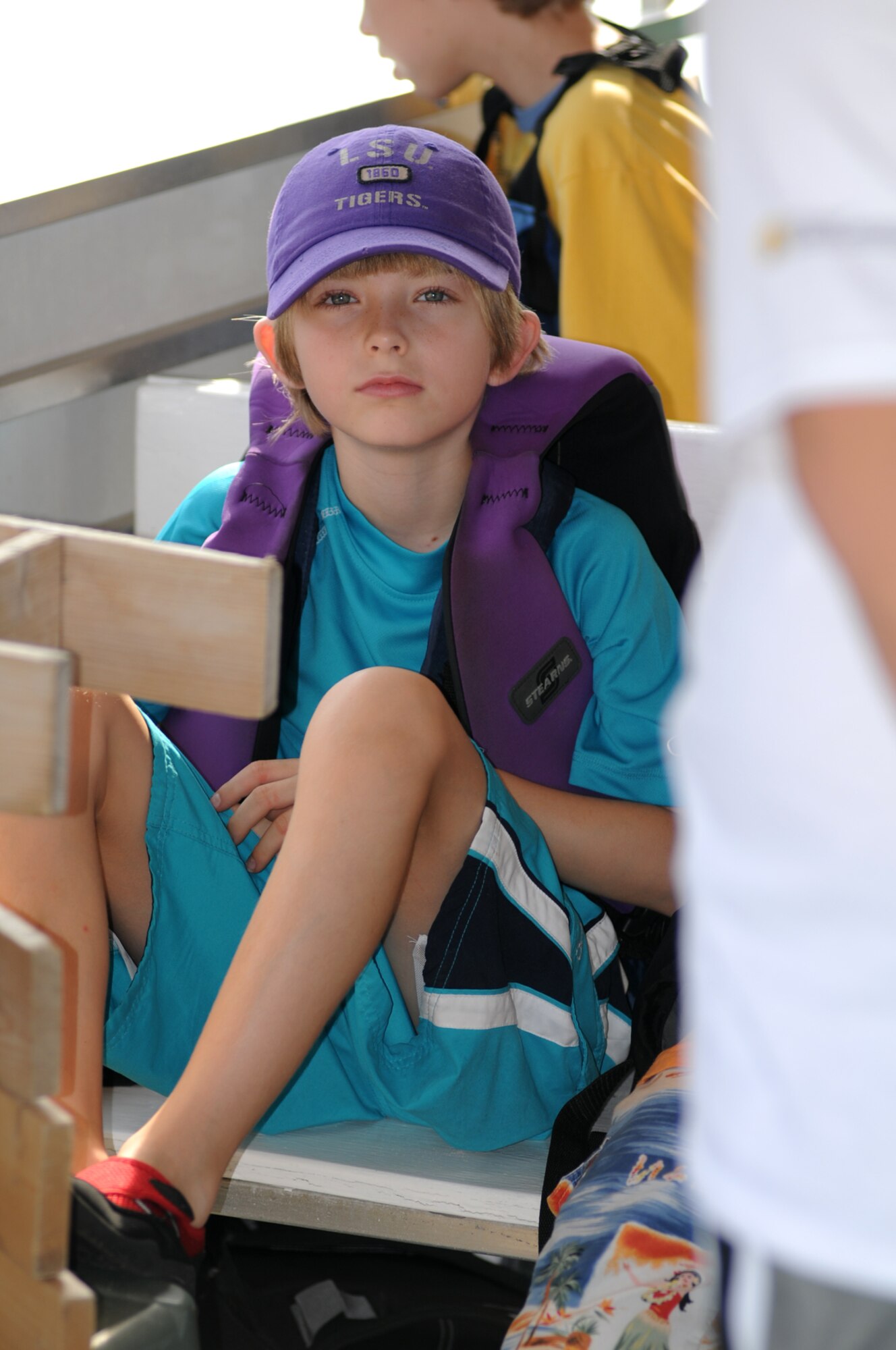 Carstens McConnville, 9, takes a seat on a boat headed to Deer Island.  His parents are Lt. Col. Abbie Luck, 81st Medical Operations Squadron, and Steve Dubois.  (U.S. Air Force photo by Kemberly Groue)