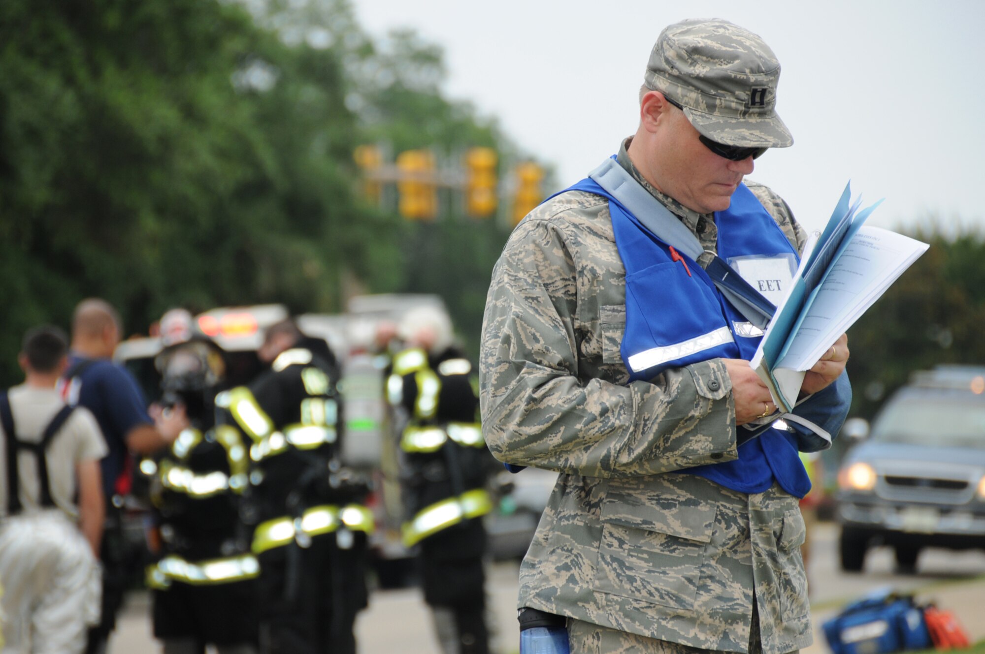 Capt. Stephen Riggs, an exercise evaluation team member from the 81st Inpatient Operations Squadron, takes notes behind Blake Fitness Center.  During the exercise, the base increased its force protection measures.  (U.S. Air Force photo by Kemberly Groue)
