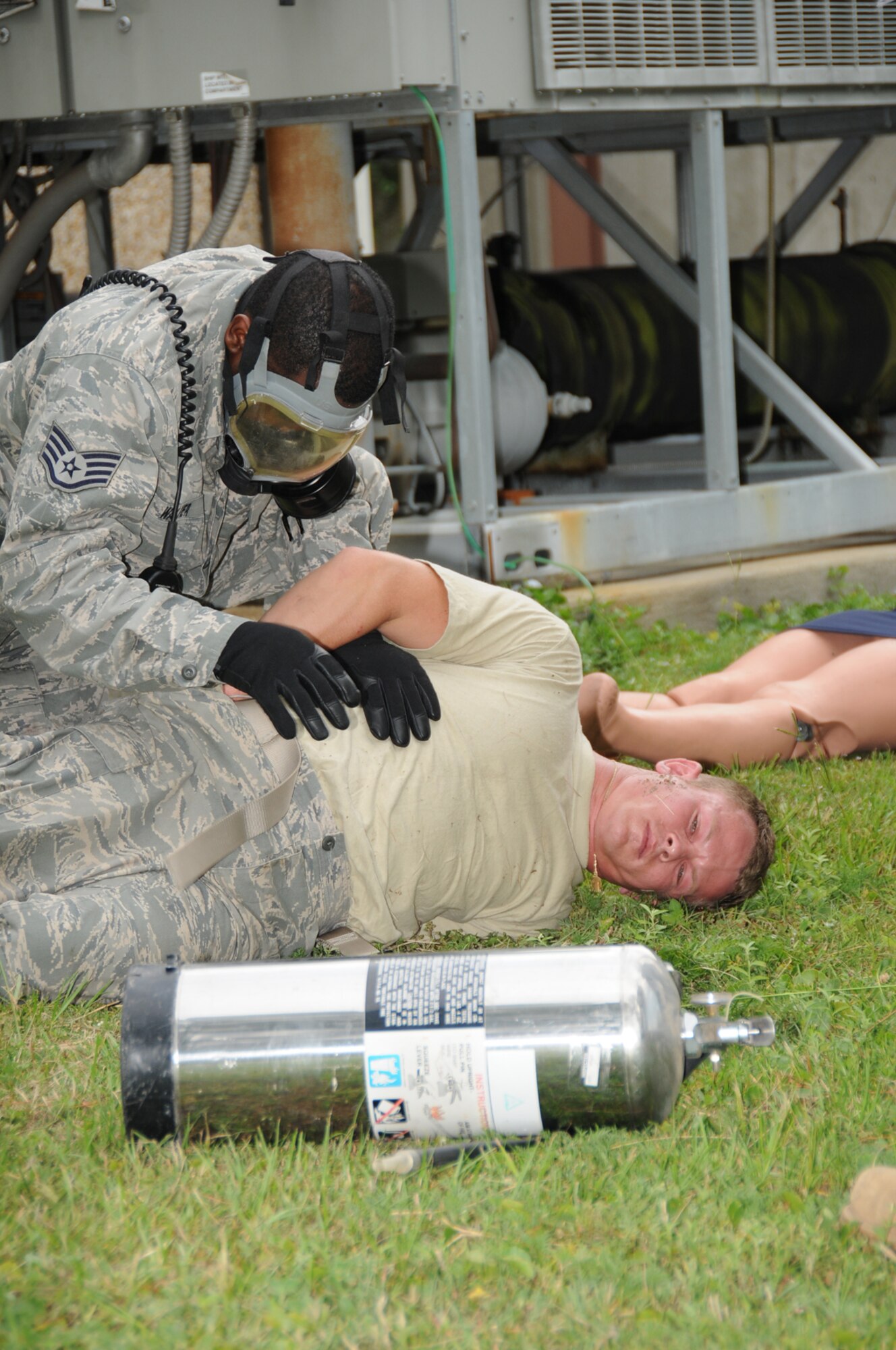 Staff Sgt. Marvin Walker, 81st Security Forces Squadron, searches Sergeant Hunter who “shot” himself.  In the scenario, Sergeant Hunter and one other person died and 19 other persons were injured.  (U.S. Air Force photo by Kemberly Groue)
