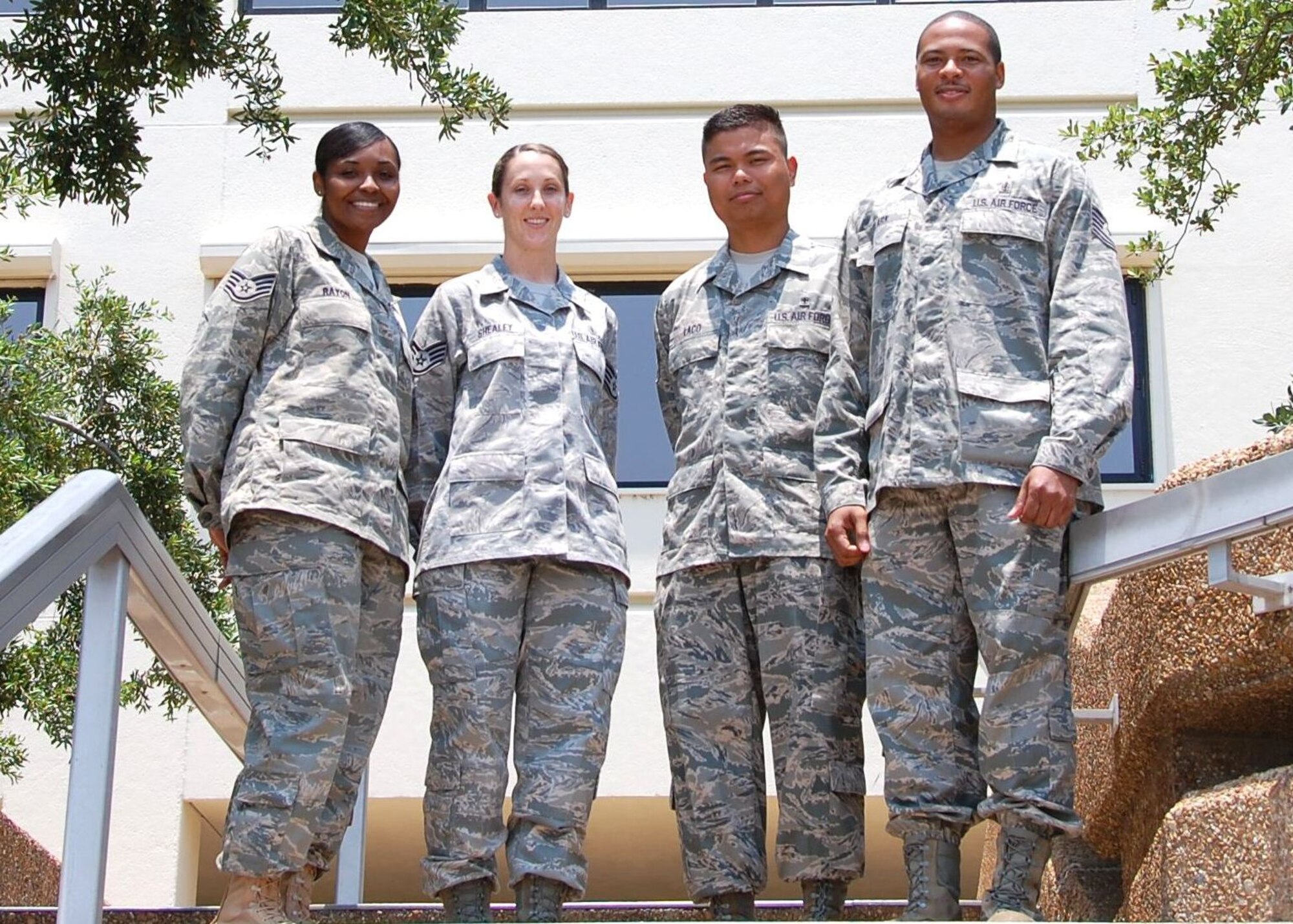 Four “Dragon Medics” have been selected for the Nurse Enlisted Commissioning Program.  Left, Staff Sgts. Alana Rayon, 81st Medical Operations Squadron, and Jessica Shealey, 81st Dental Squadron; Senior Airman Rupert Laco, 81st Inpatient Operations Squadron; and Tech. Sgt. Donelle Clark, 81st Surgical Operations Squadron, learned they were accepted June 10 and begin begin the two-year program in August.  (U.S. Air Force photo by Steve Pivnick)