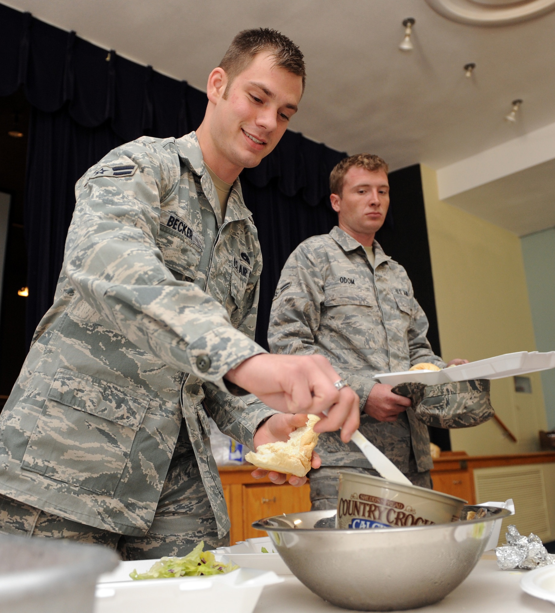 MOUNTAIN HOME AIR FORCE BASE, Idaho -- Airman 1st Class Andrew Becker, 366th Maintenance Operations Squadron maintenance scheduler, prepares his food at the community center during a Chief’s Steak Burn June 16. Money raised from the steak burn helps offset costs of quarterly and annual awards. (U.S. Air Force photo by Airman 1st Class Debbie Lockhart)