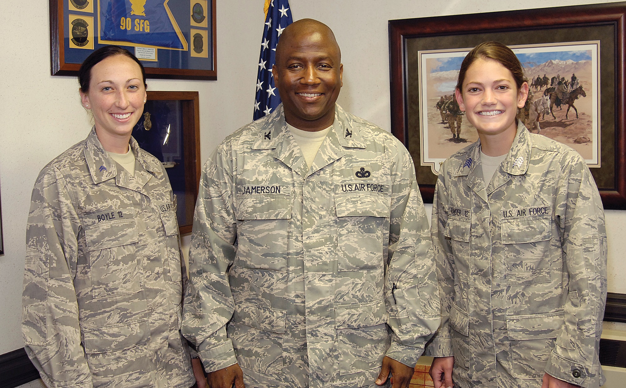 Air Force Academy cadets, Katie Boyle, left, and Alexa Ramsier, right, spent time in the 72nd Air Base Wing’s Public Affairs office where they attended meetings, helped plan tours, wrote articles and had a chat with 72nd ABW wing commander, Col. Allen Jamerson, center. (Air Force photo by Margo Wright)