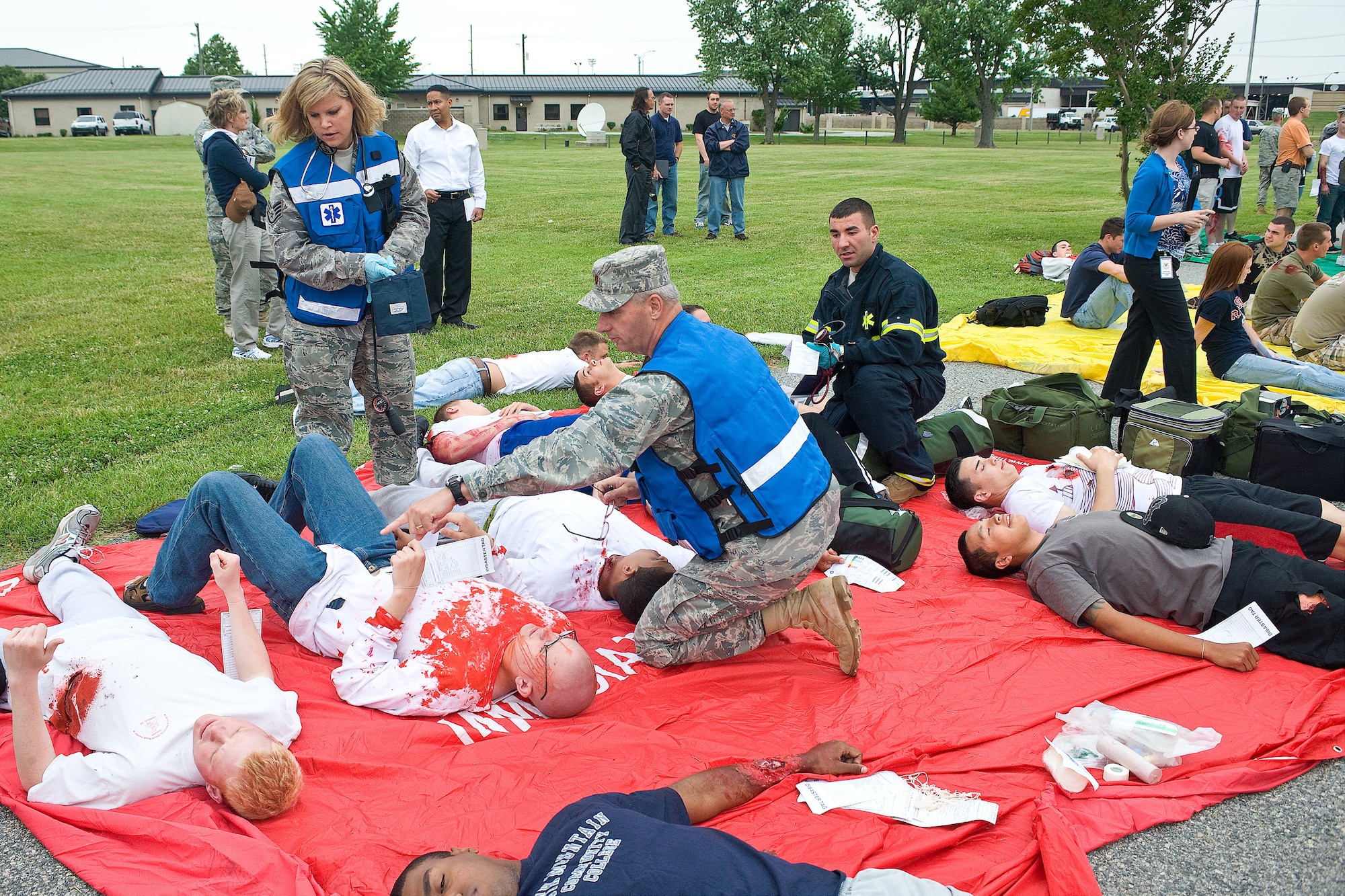 Members of the 436th Medical Group and other first responders work to triage the role players at a medical emergency exercise June 9, 2010. The exercise was tailored to train the medical group and other first responders on handling and responding to medical disasters. (U.S. Air Force photo by Roland Balik/Released)
