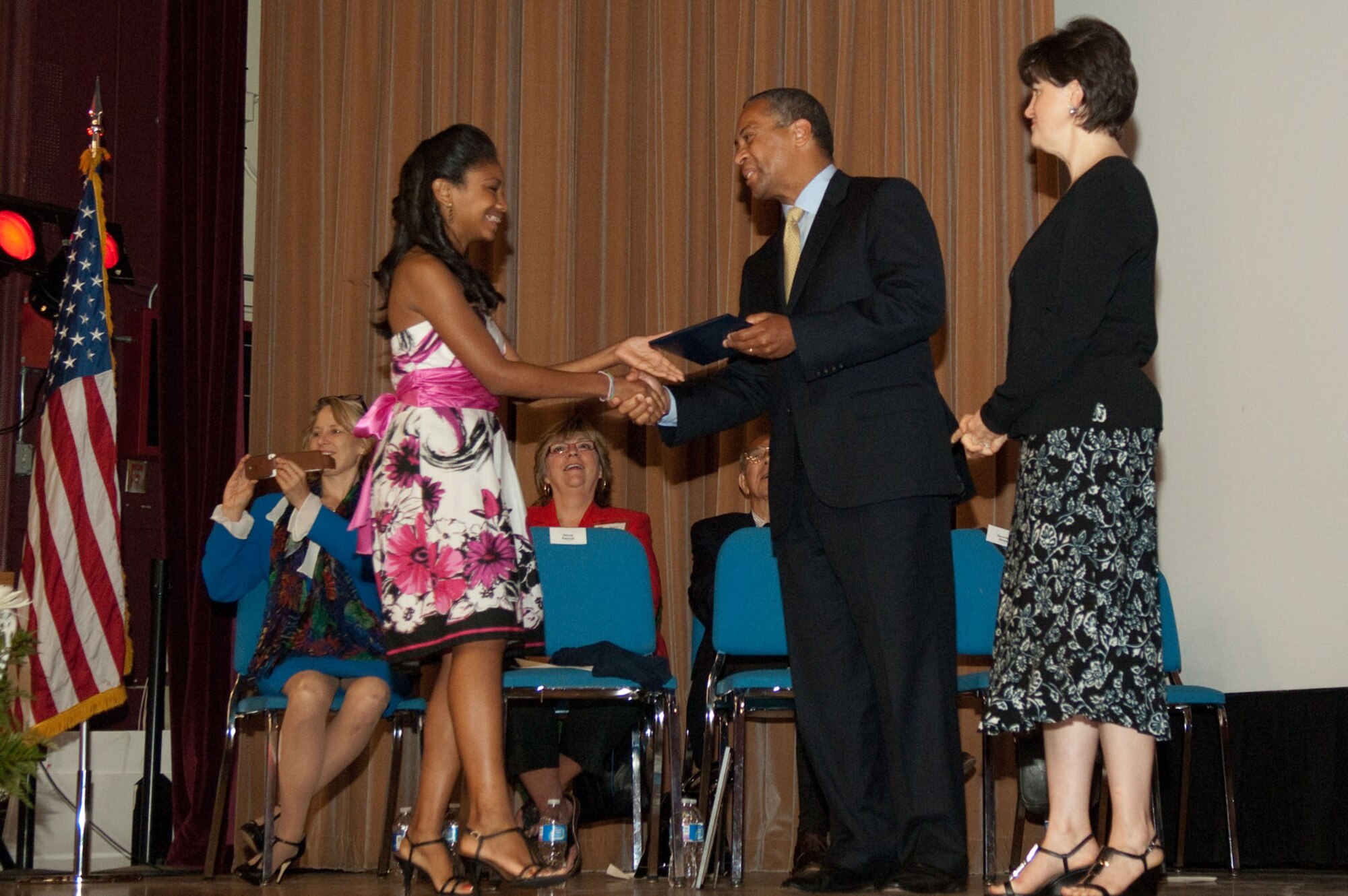 HANSCOM AIR FORCE BASE, Mass. – Chelsea Taymes, a Hanscom Middle School graduate, shakes Massachusetts Gov. Deval Patrick hand as she prepares to accept her diploma on June 17. Governor Patrick visited the base to take part in Hanscom Middle School’s graduation ceremony. (U.S. Air Force photo by Rick Berry)