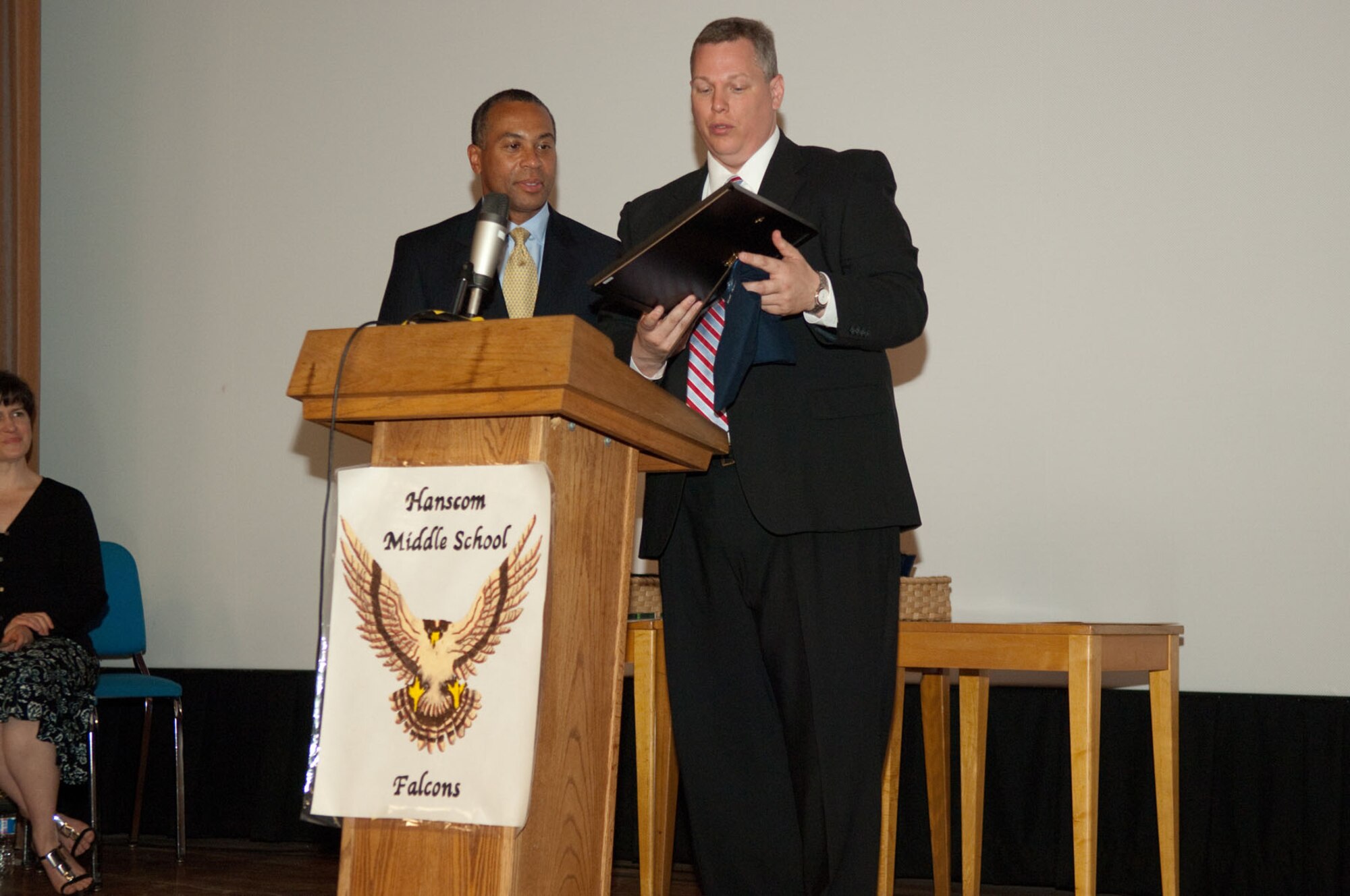 HANSCOM AIR FORCE BASE, Mass. – Massachusetts Gov. Deval Patrick (left) accepts a certificate from Erich Ledebuhr, Hanscom Middle School principal, during his visit on June 17. Governor Patrick visited the base to take part in Hanscom Middle School’s graduation ceremony. (U.S. Air Force photo by Rick Berry)