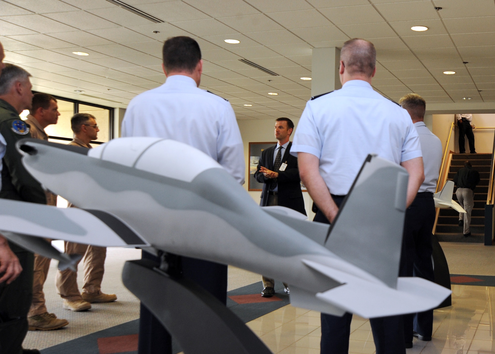 Michael K. Rambo, Hawker Beechcraft Corporation partner development and program security manager, speaks with commanders from the 22nd Air Refueling Wing, 931st Air Refueling Group, 184th Intelligence Wing and 134th Air Refueling Wing tour the facility of Hawker Beechcraft Corporation June 21, 2010, Wichita, Kan.  Various units from Team McConnell were involved in helping with the developmental testing of Hawker Beechcraft’s AT-6 prototype aircraft.   As the closest military neighbor, Airmen from McConnell were invited to tour the facility that manufactures a wide variety of high-performance business jets, turboprops, pistons, military and special mission aircraft.  (U.S. Air Force photo/Airman 1st Class Andrea Salazar)