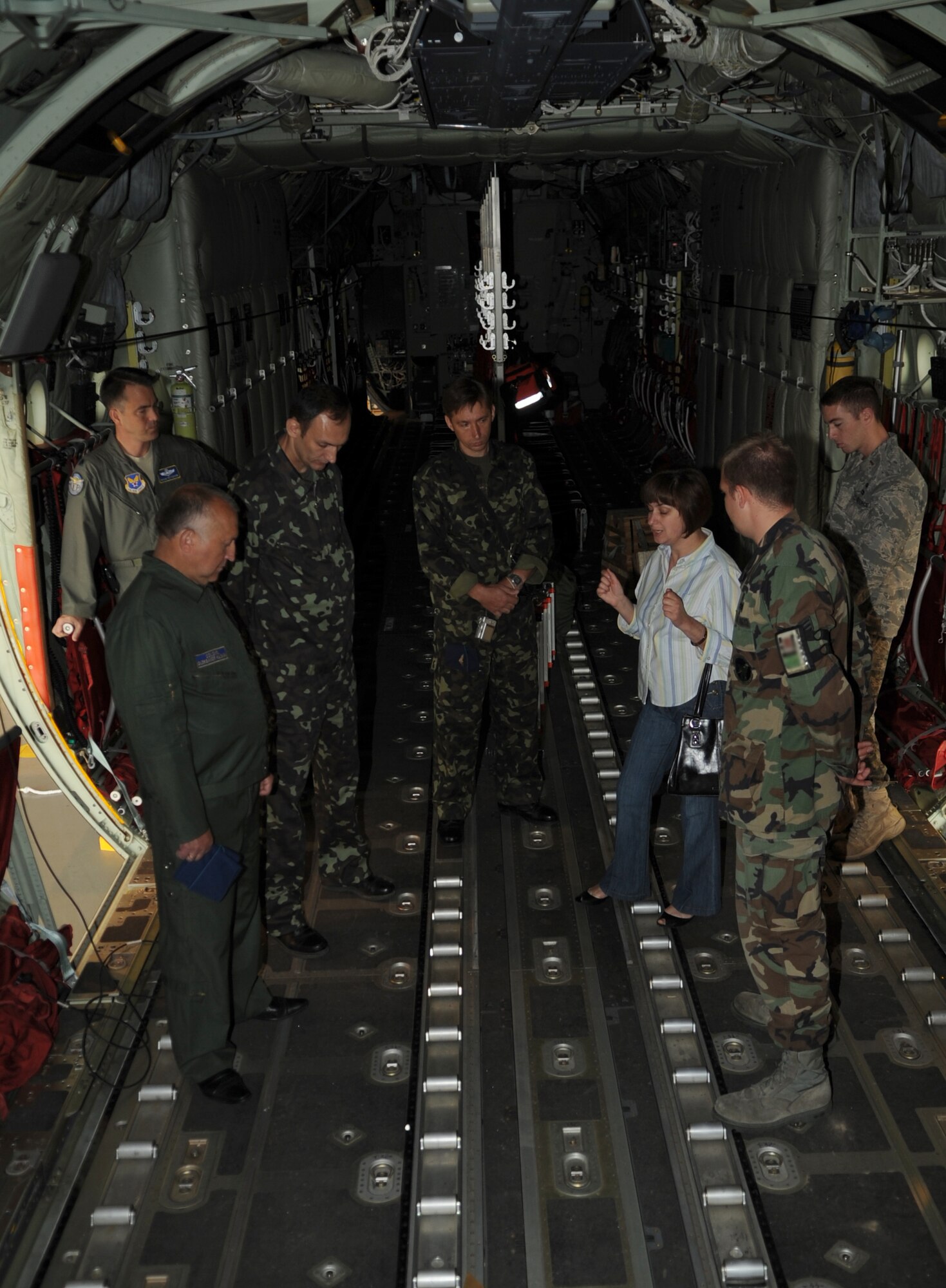 U.S. Air Force Senior Airman Joshua Sauer, 86th Maintenance Squadron C-130J crew chief, gives a tour of a C-130J to Ukraine Air Force members during a visit to Ramstein Air Base, Germany, June 24, 2010.  The goal of the Ukrainian visit was to help advance military interoperability and build international partnerships. (U.S. Air Force photo by Senior Airman Caleb Pierce)