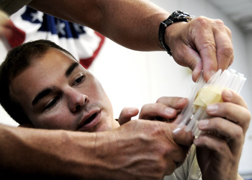 Tech. Sgt. Paul Greene, 919th Aircraft Maintenance Squadron, helps his group during the “protect the egg” project on the first week of the NCO development course at Duke Field.  22 919th Special Operations Wing NCOs and soon to be NCOs attended the two-week course to learn about leadership, management and communication.  U.S. Air Force photo /Tech. Sgt. Samuel King Jr.