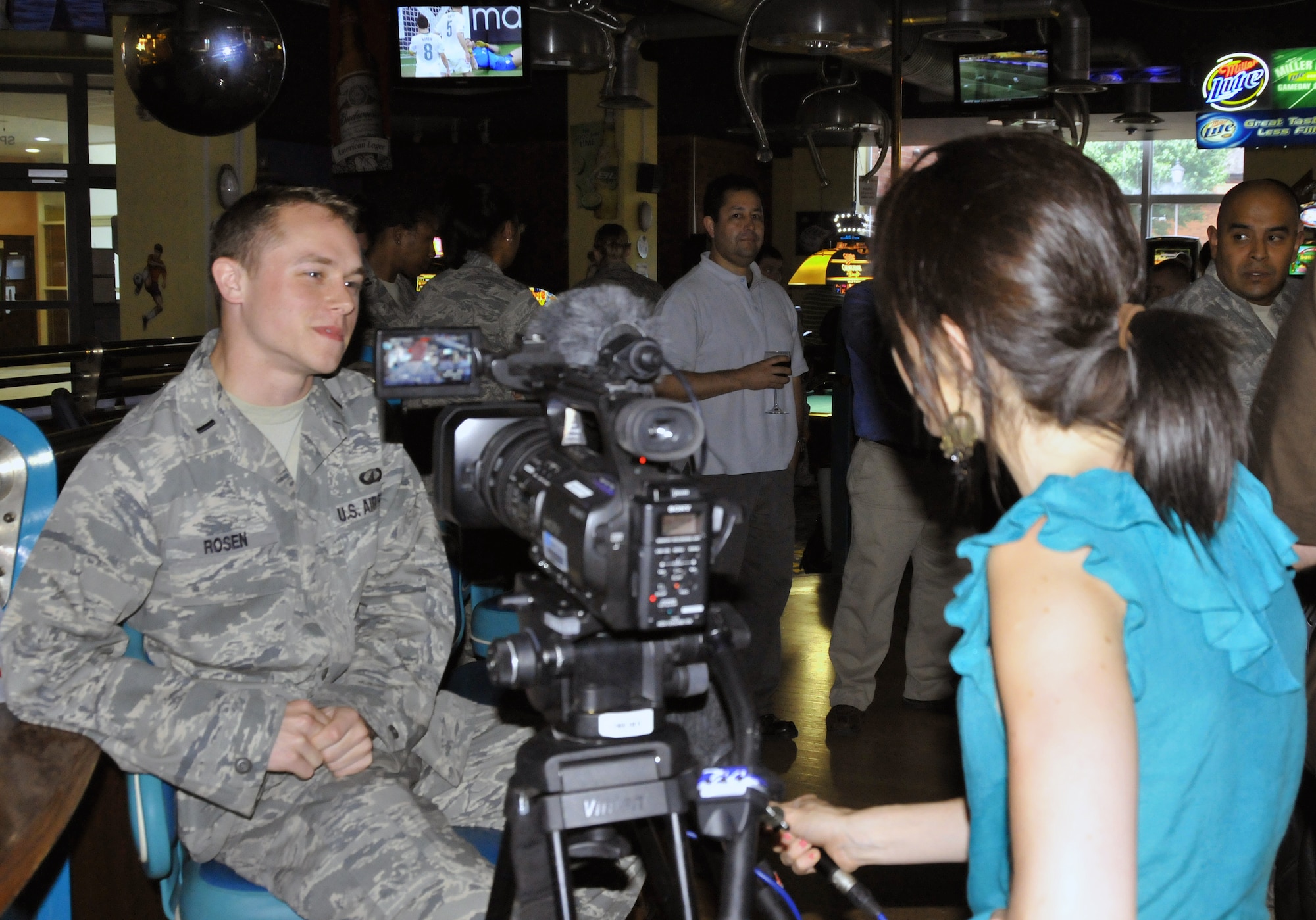 1st Lt. Philip Rosen, 100th Comptroller Squadron, entertains a half-time interview during the USA versus Algeria 2010 FIFA World Cup South Africa soccer match aired at the Galaxy Club at RAF Mildenhall June 23. Lieutenant Rosen expressed his joy in seeing so many Team USA supporters, as well as Team England supporters come out to watch both teams simultaneously move into the "Final 16" match in pursuit of the World Cup. Team USA won the Group C competition, and England took 2nd place. (US Air Force Photo/USAFA Cadet 2nd Class Lauren Delaney)