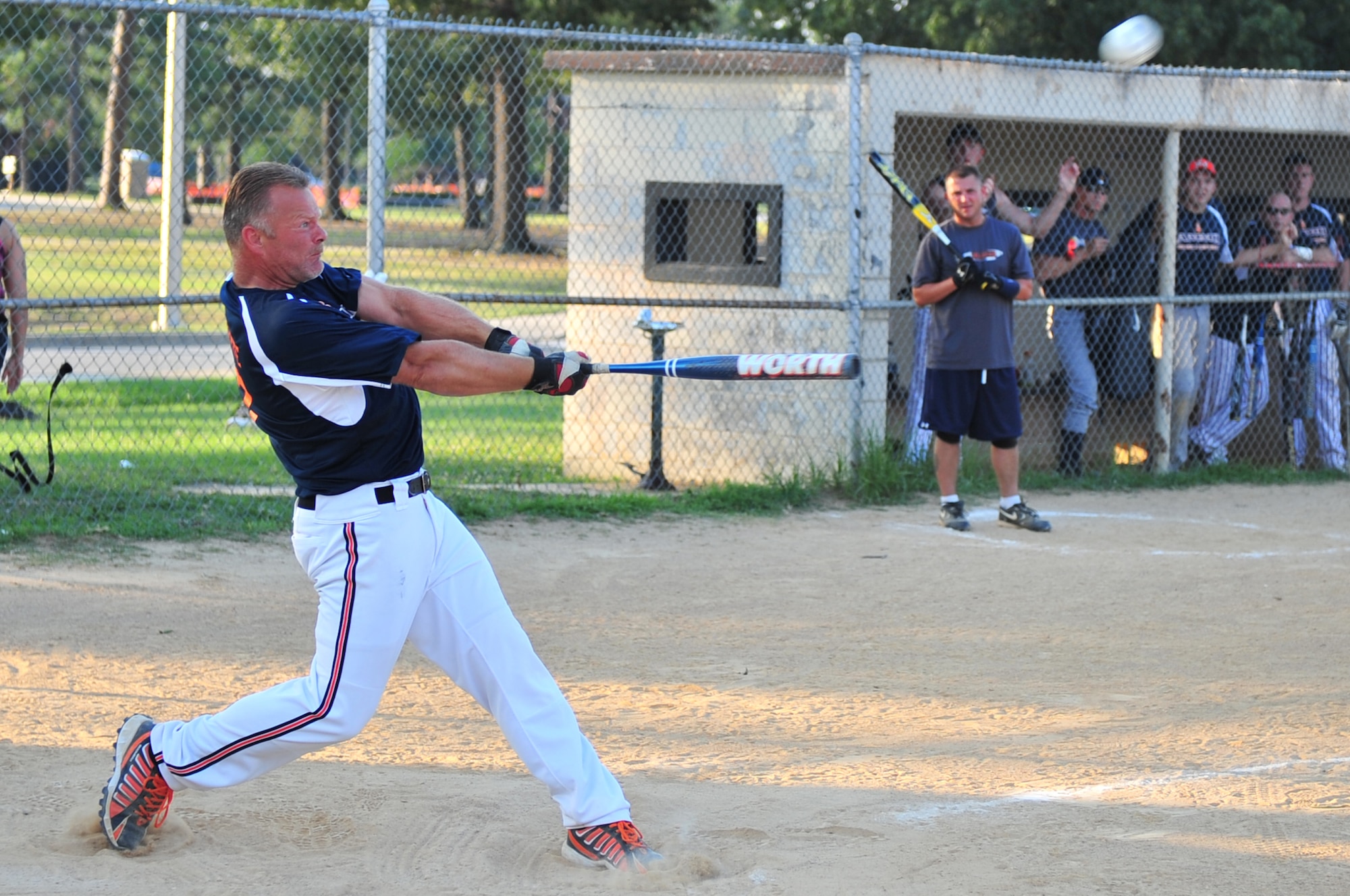 SEYMOUR JOHNSON AIR FORCE BASE, N.C. -- Doug Guerette hits a softball during a semi-final game in the Eagles Grand Slam Jamboree Softball Tournament here June 21, 2010. The regular season for the intramural league started April 12, 2010. Guerette is a member of the 4th Equipment Maintenance Squadron's Ammunition Flight team. He hails from Milford, N.H. (U.S. Air Force photo/Senior Airman Rae Perry)