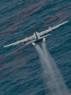A U.S. Air Force C-130 Hercules aircraft from the 910th Airlift Wing, Youngstown-Warren Air Reserve Station, Ohio, drops oil-dispersing chemicals into the Gulf of Mexico May 9, 2010. Members of the wing are in the region to respond to the Deepwater Horizon oil spill. The wing specializes in aerial spraying and is the Department of Defense?s only large-area, fixed-wing aerial spray unit. (U.S. Air Force photo by Tech. Sgt. Adrian Cadiz/Released)  