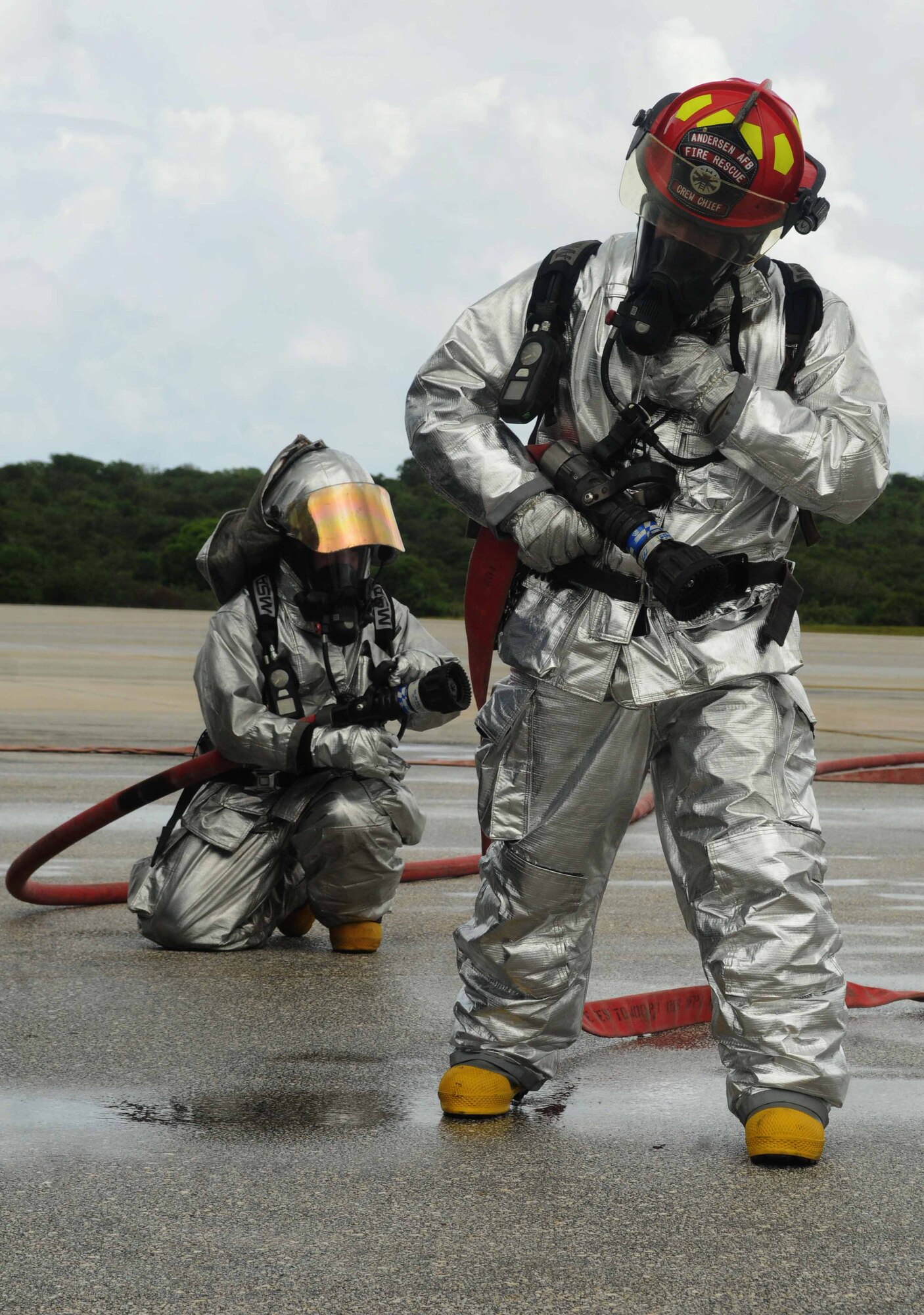 ANDERSEN AIR FORCE BASE, Guam - Members of the 36th Civil Engineer Squadron conduct aircraft firefighting training here June 23. The training is required quarterly and is conducted on the flightline. (Air Force photo by Airman Whitney Amstutz)