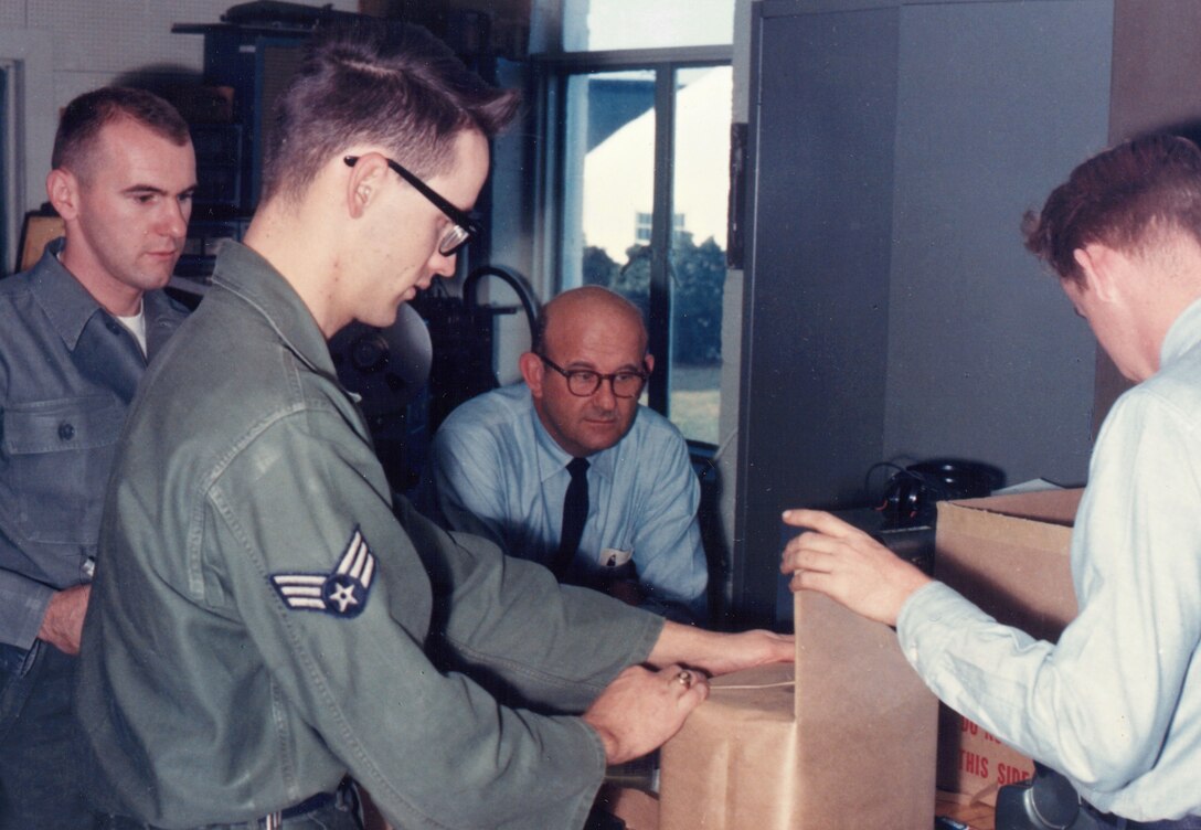 From November, 1964: This photograph is of John Bailey, Gerry Schwinger, Al Derecki and John Long who worked in the Audio Section of The United States Air Force Band.  Please take a moment to reflect on the photograph shown here. If you have any insight regarding who is in it, when or where it was taken, or any stories you can share about the event, please email our Band Historian <a href="mailto:usafbandhistorian@afncr.af.mil">Technical Sgt. Tracey MacDonald</a>. Thank you and we look forward to hearing from you!  This is Photo 33. (Unknown Photographer)