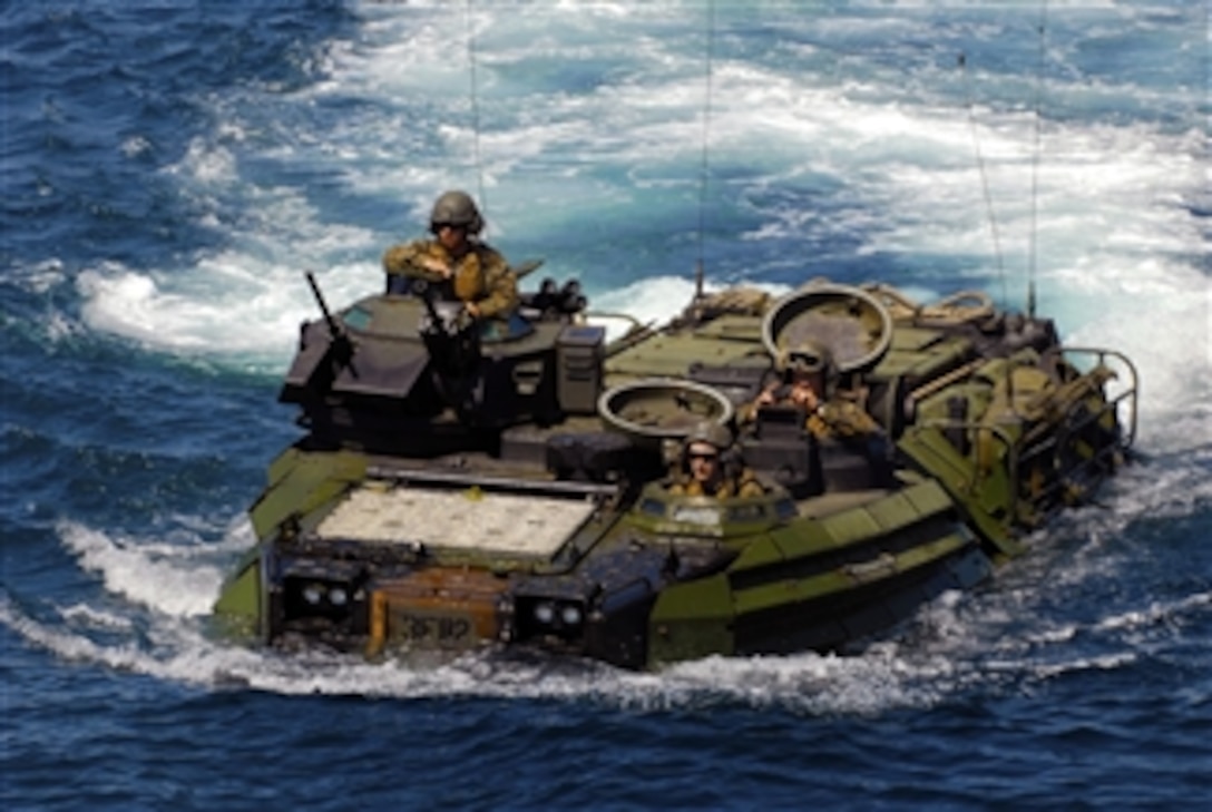 U.S. Marines from the 1st Battalion, 4th Marine Division return to the amphibious transport dock ship USS Dubuque (LPD 8) in an amphibious assault vehicle after training with Indonesian marines during Marine Exercise 2010 on June 22, 2010.  Marine Exercise is designed to provide training to the Indonesian military and build relationships that help maintain regional stability.  