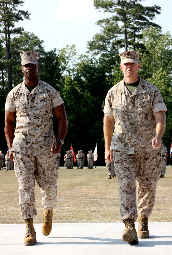 Lt. Col. Jerry G. Carter (left), the outgoing commanding officer of 2nd Radio Battalion, II Marine Expeditionary Force Headquarters Group, and Lt. Col. Matthew G. Rau, the incoming CO of 2nd Radio Bn., march on Soifert Field during a change of command ceremony June 24, 2010, aboard Marine Corps Base Camp Lejeune, N.C.